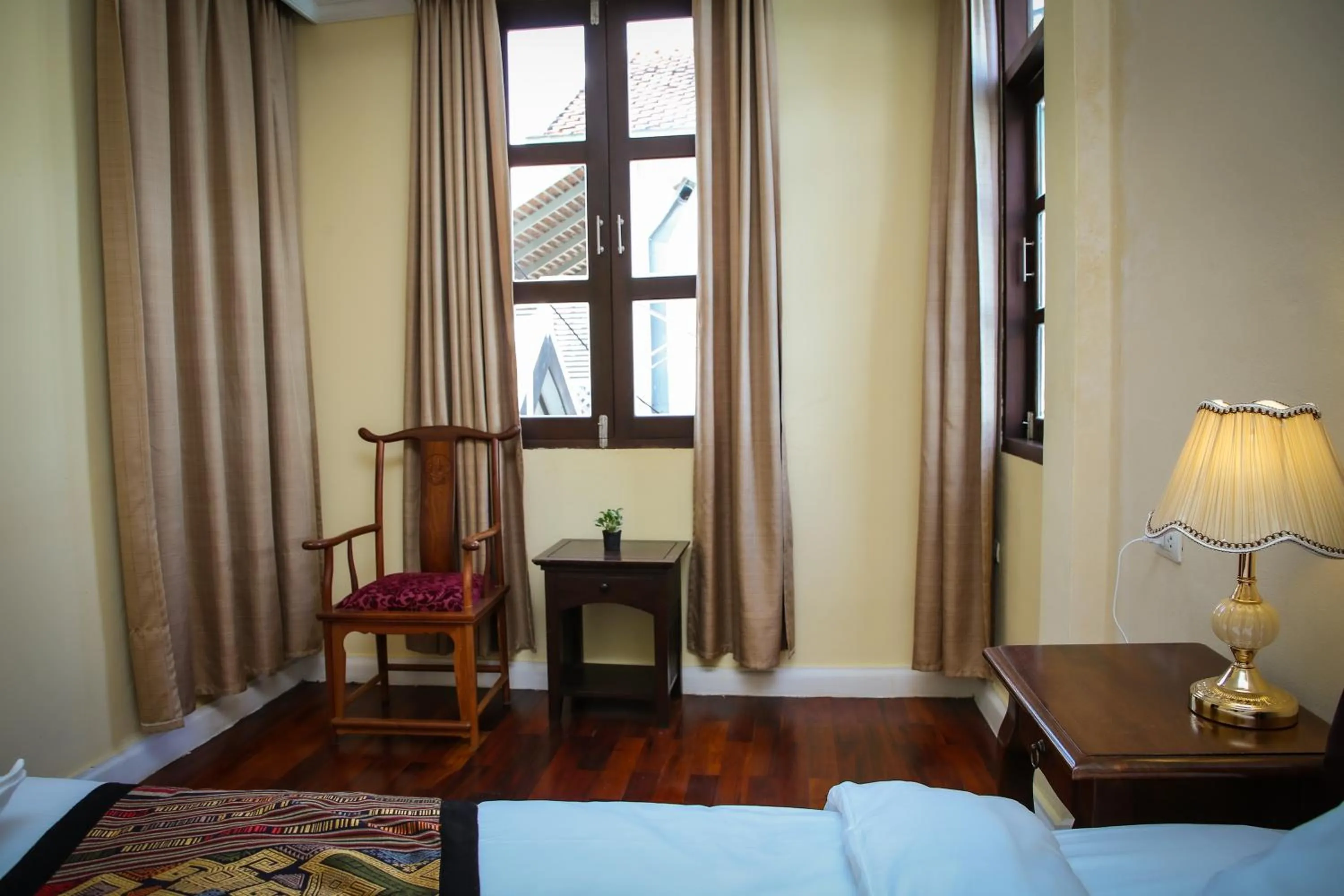 Bed in Le Luxe Boutique Hotel