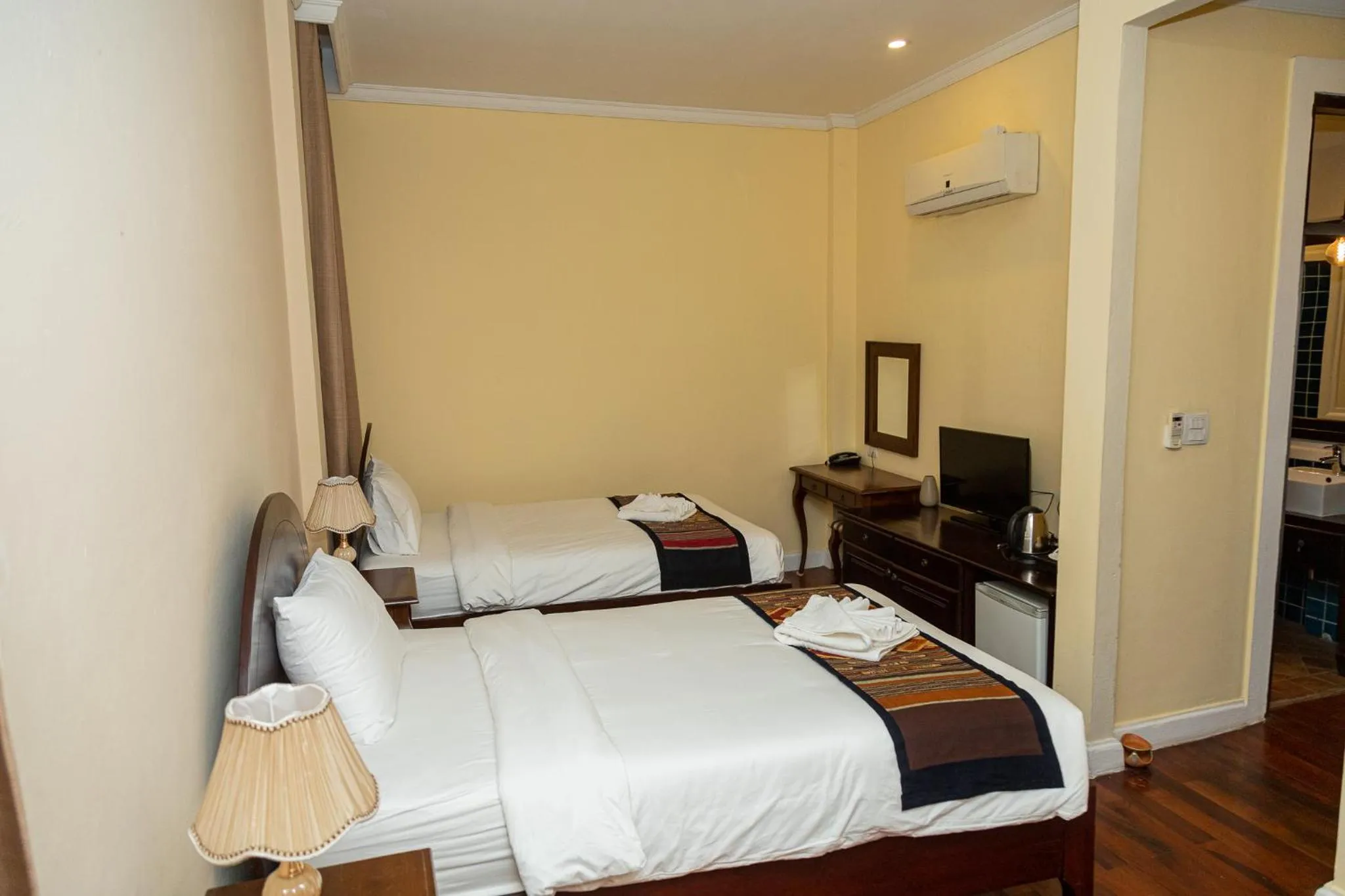 Bed in Le Luxe Boutique Hotel