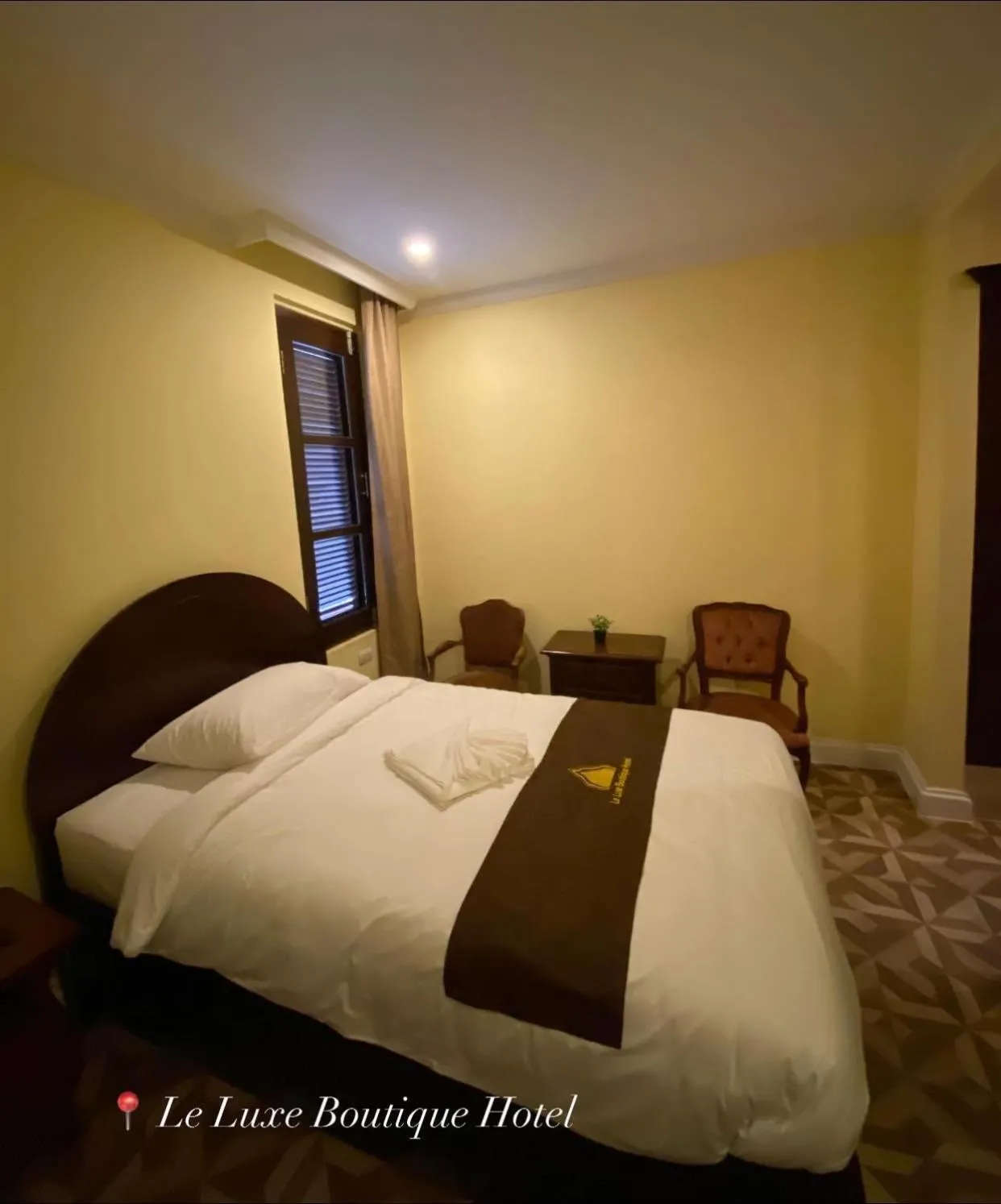 Bed in Le Luxe Boutique Hotel