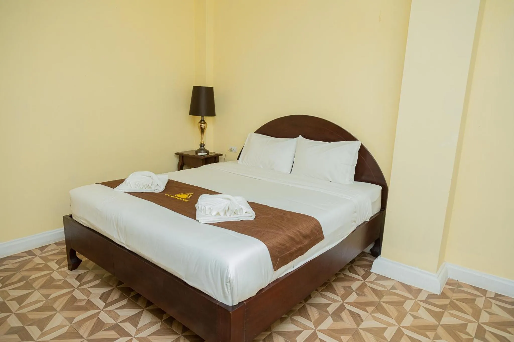 Bed in Le Luxe Boutique Hotel