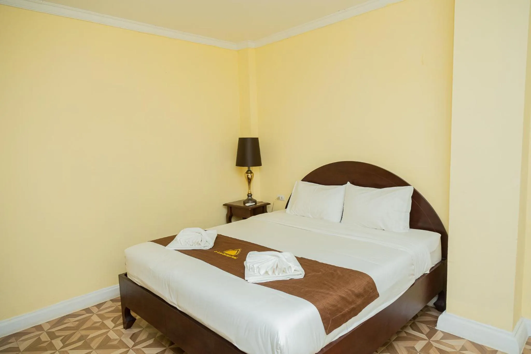 Bed in Le Luxe Boutique Hotel