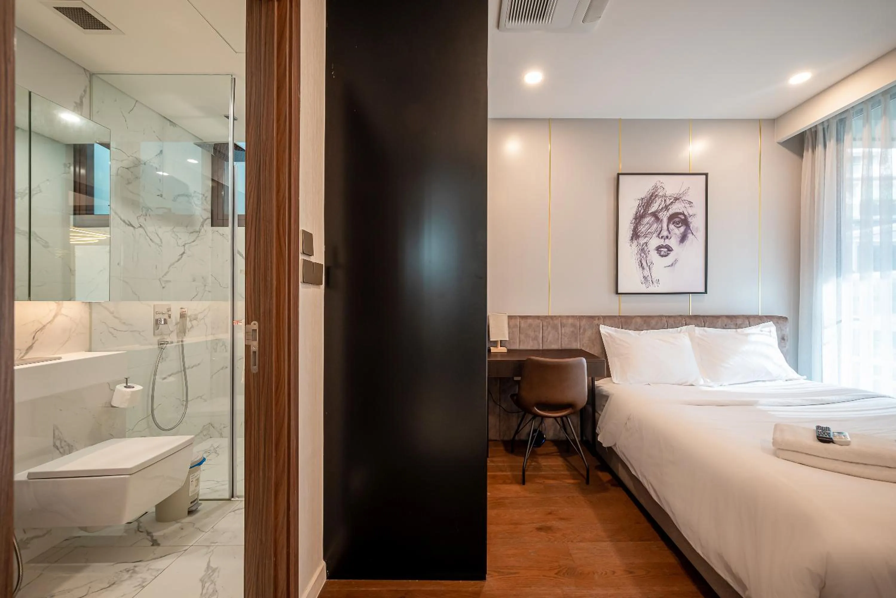 Shower, Bed in Metropole Thu Thiem Condo Apartment