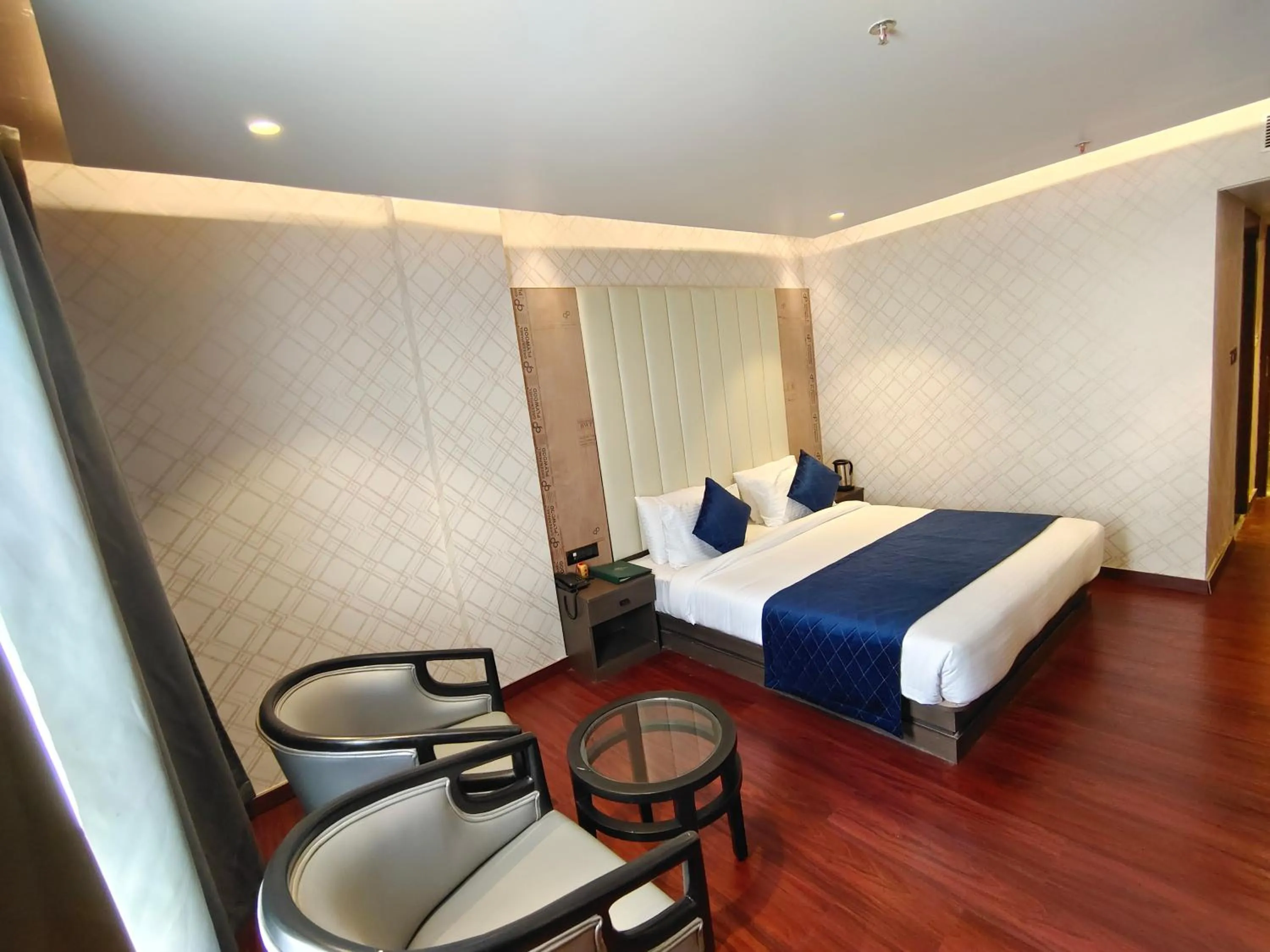 Bed in The Emerald Hotel & Siya Milan Banquets