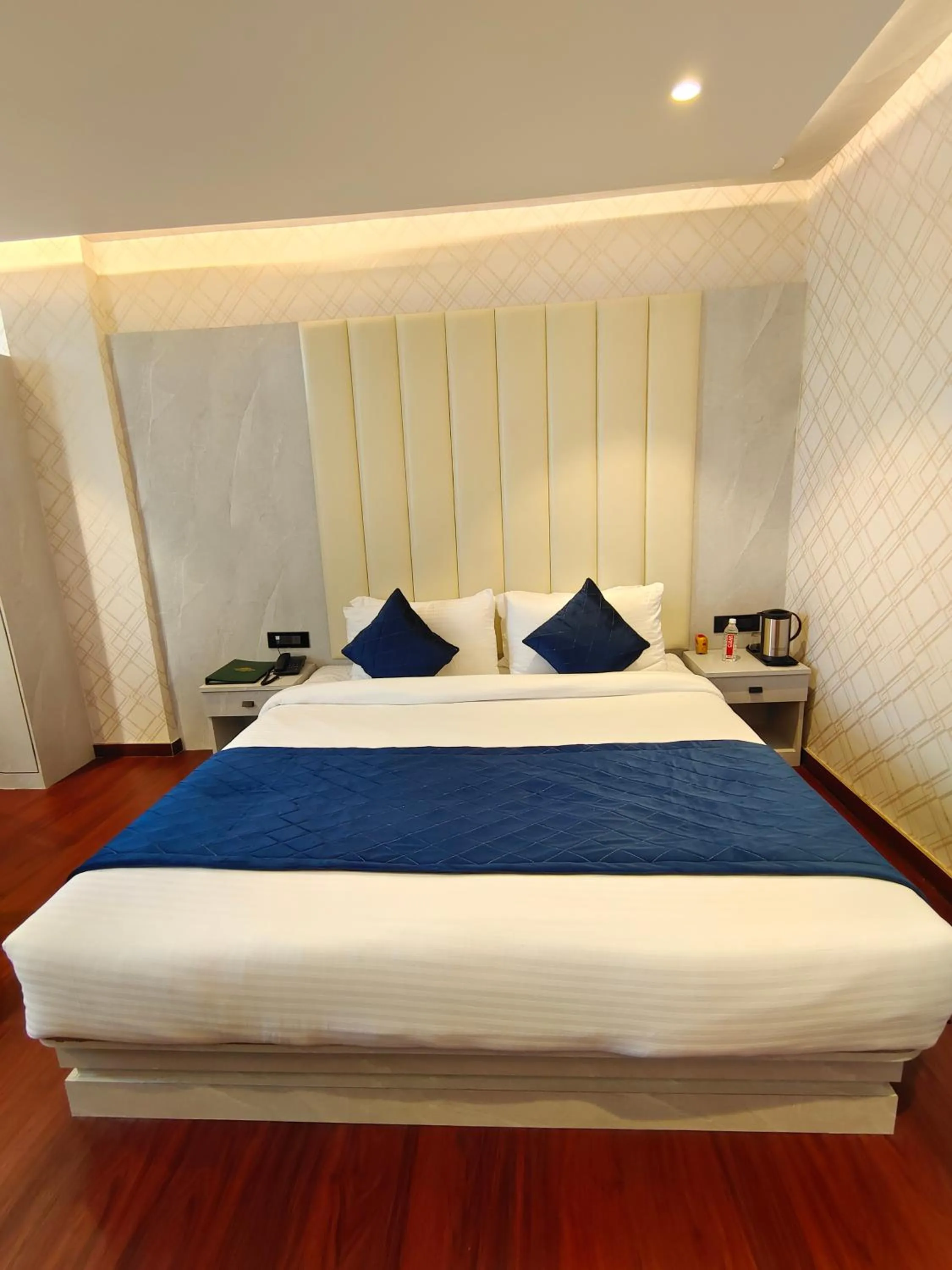 Bed in The Emerald Hotel & Siya Milan Banquets