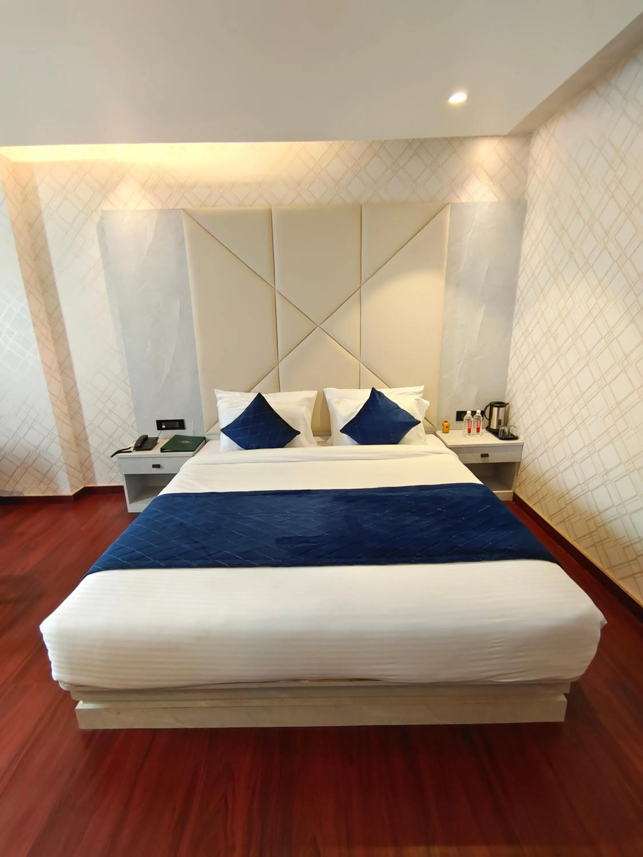 Bed in The Emerald Hotel & Siya Milan Banquets