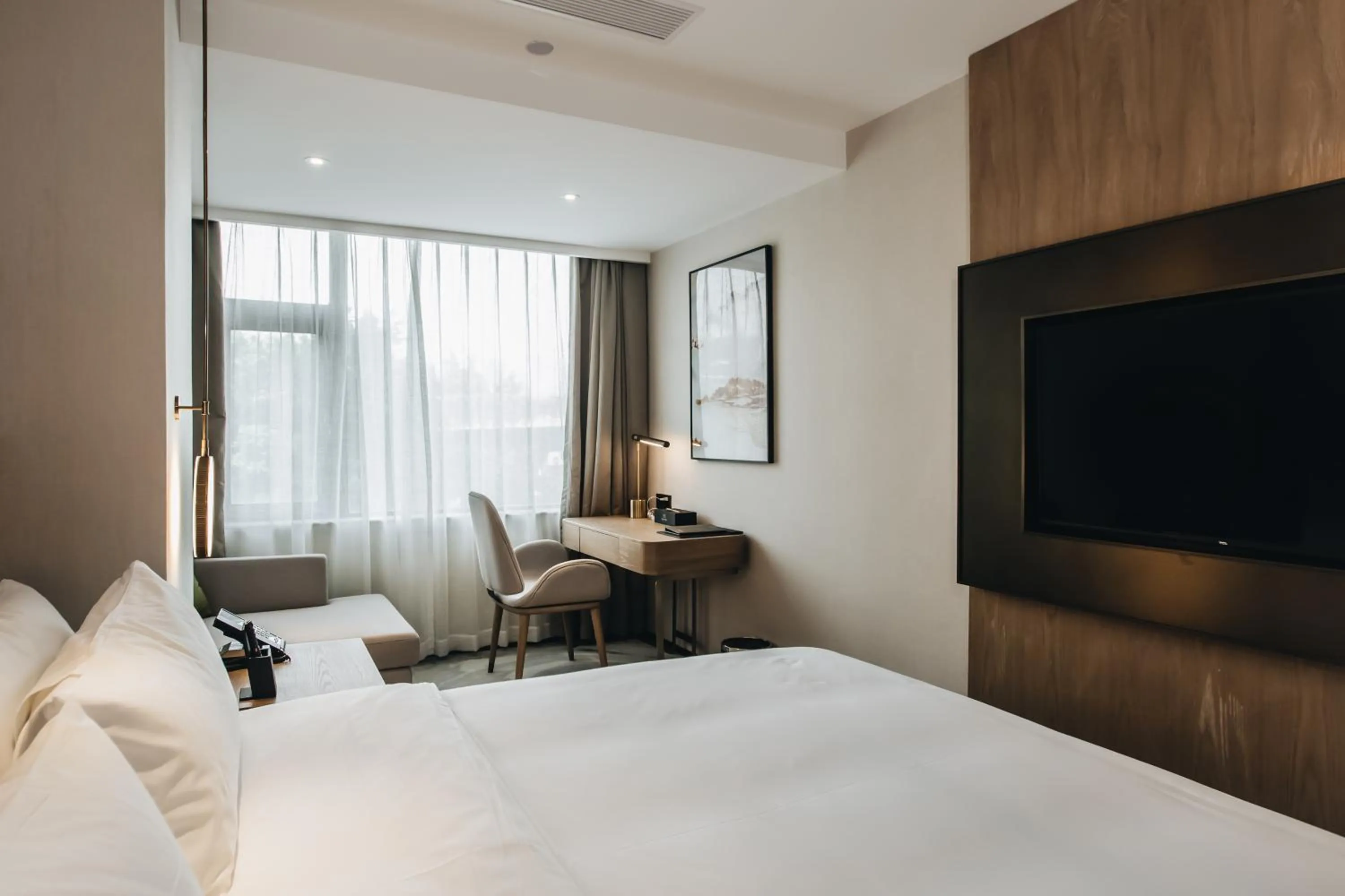 Photo of the whole room, Bed in Orienwit Hotel-Free Shuttle Bus fir Canton Fair