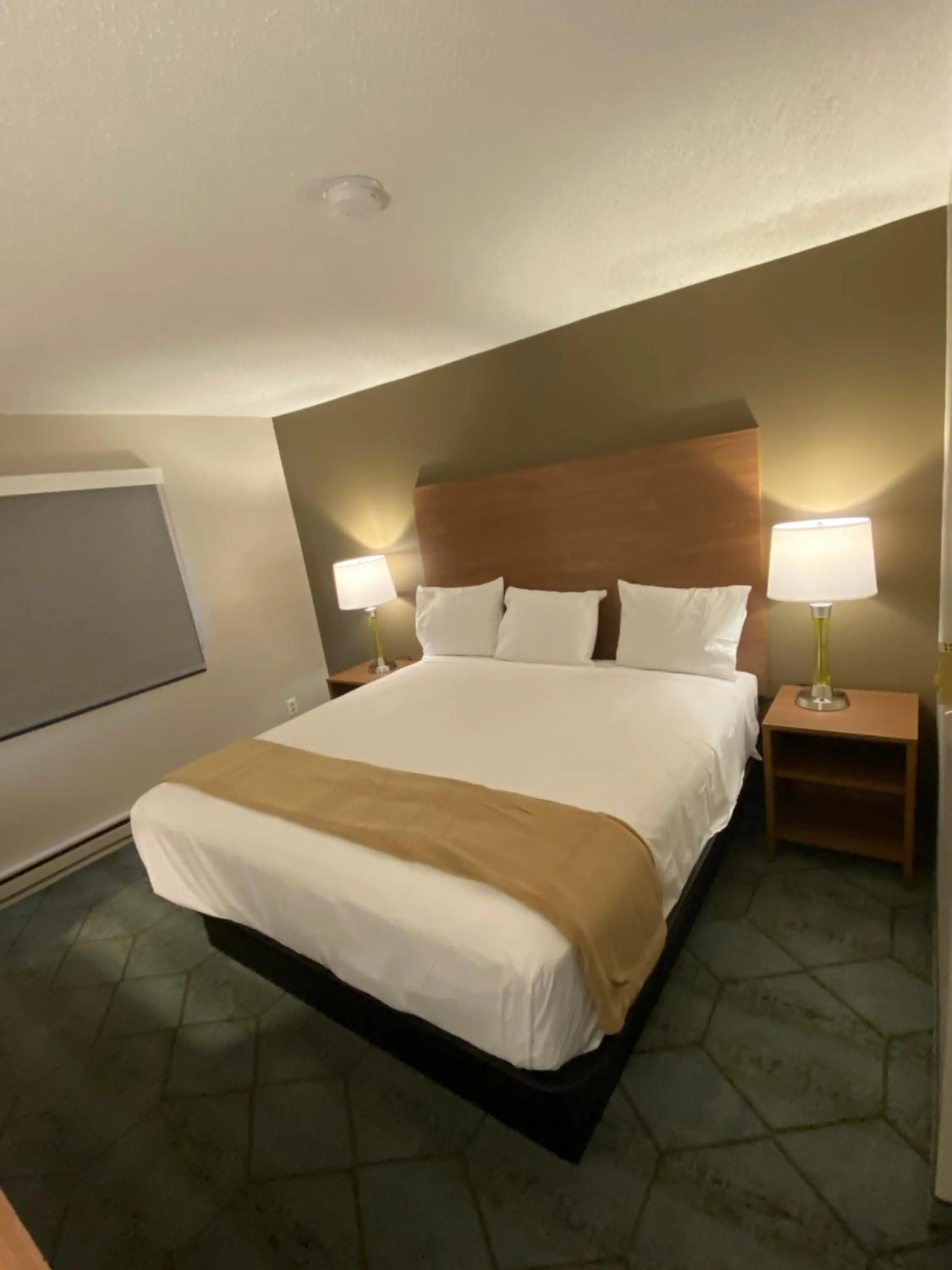Bed in Super 8 by Wyndham Oshkosh Airport