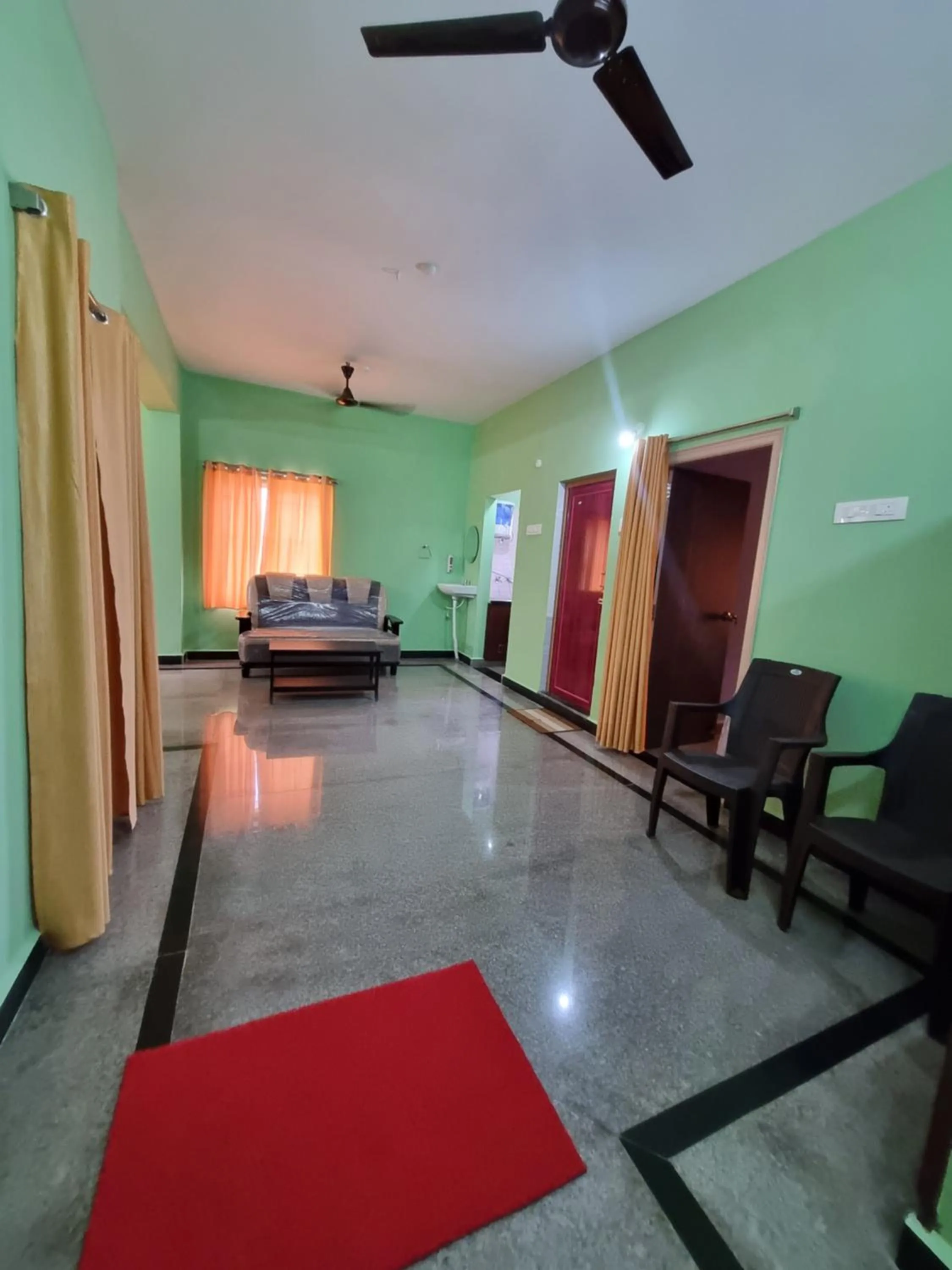 Living room, Bed in Aditya Homestay