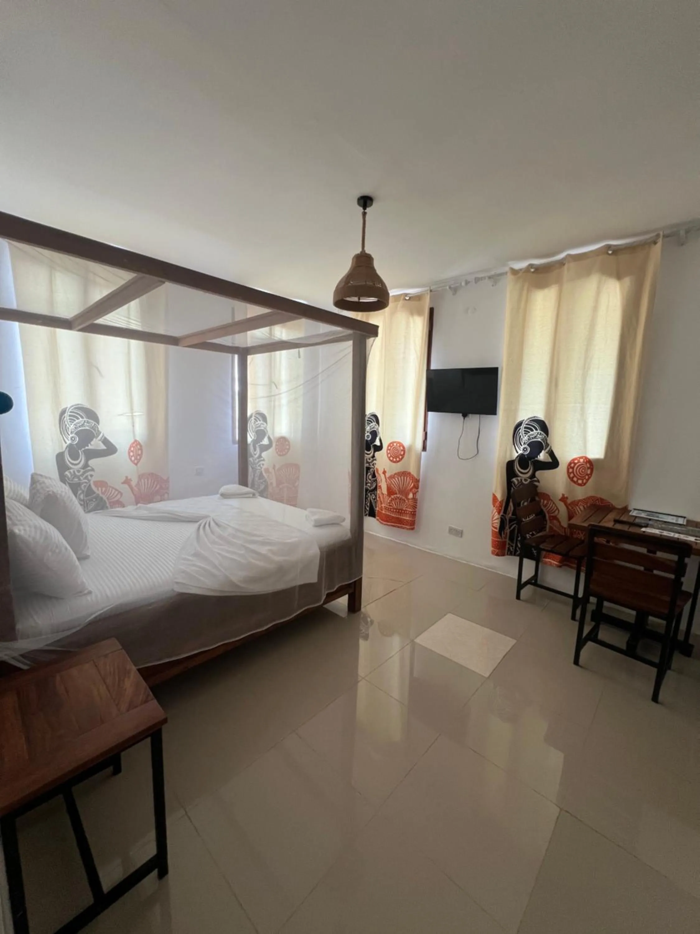 Bed in Light of Zanzibar Hotel