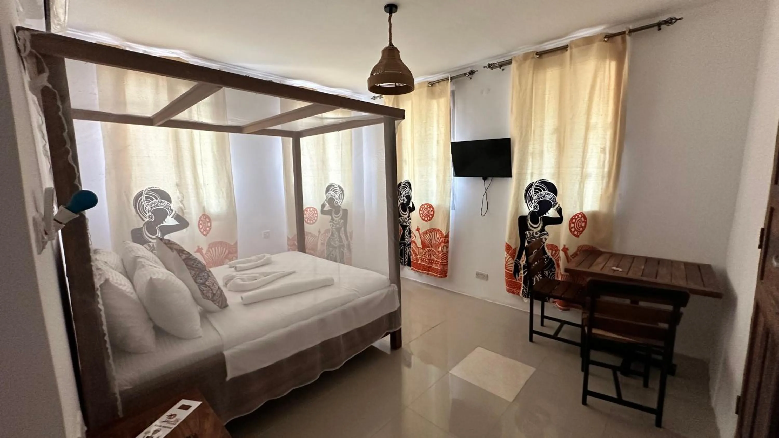 Bed in Light of Zanzibar Hotel