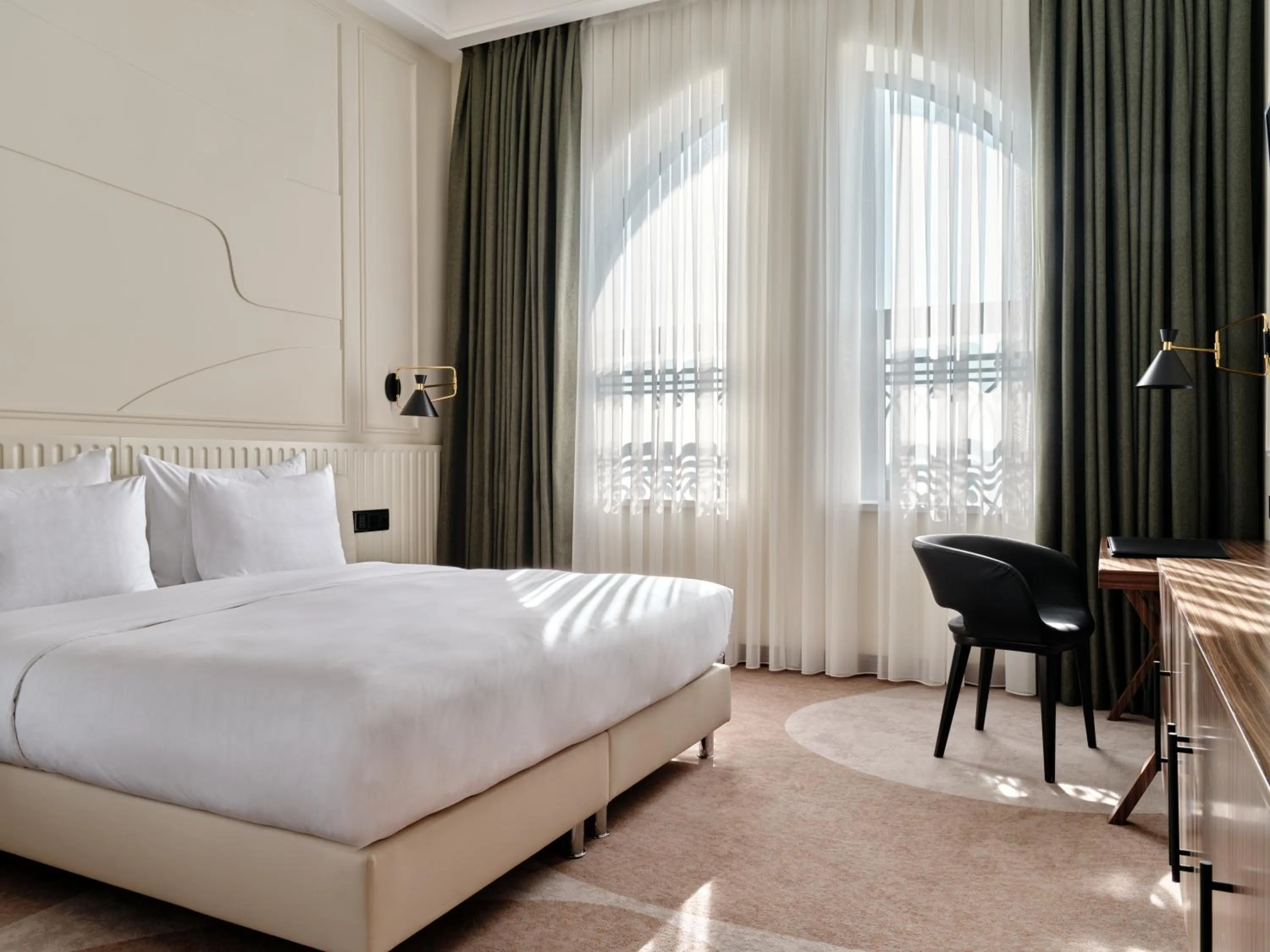 Bed in Crowne Plaza Tashkent, an IHG Hotel