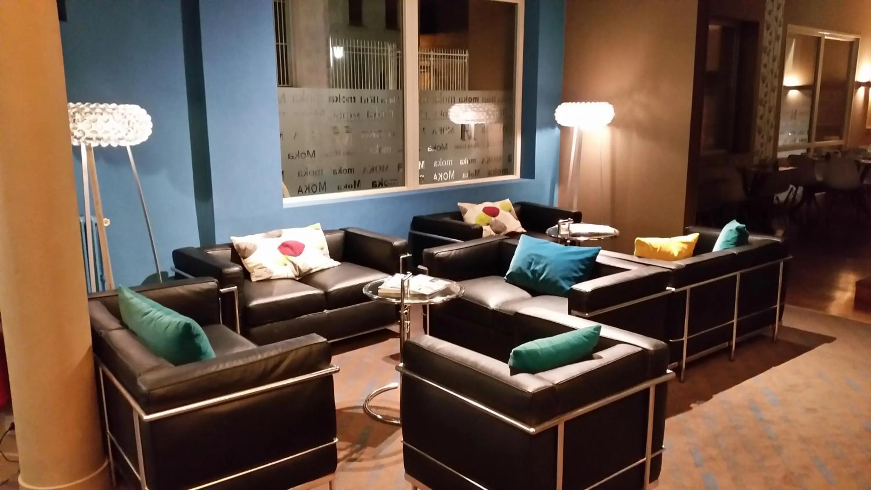 Communal lounge/ TV room in Moka Hotel