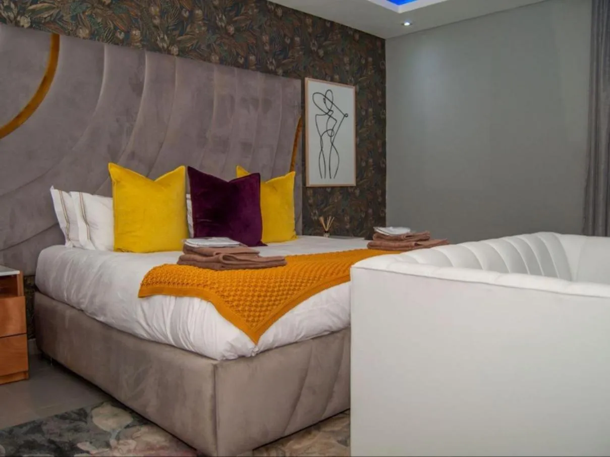 Bed in The Lux Hotel and Resorts