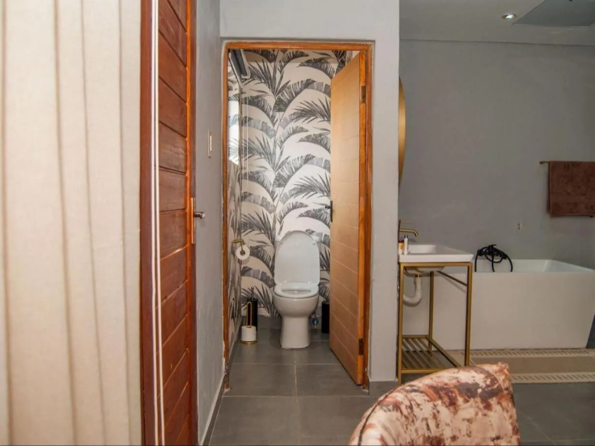 Toilet in The Lux Hotel and Resorts