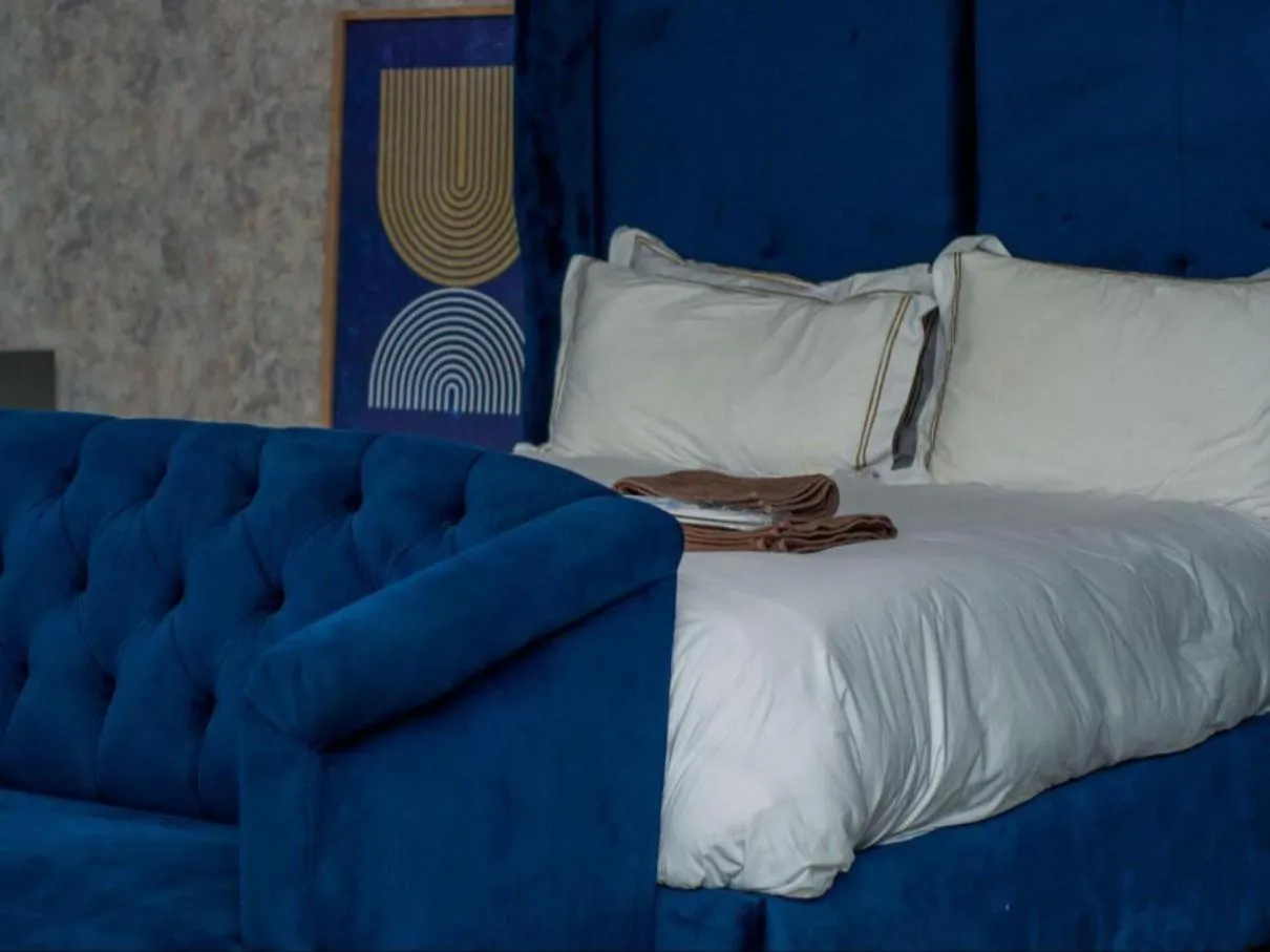 Bed in The Lux Hotel and Resorts