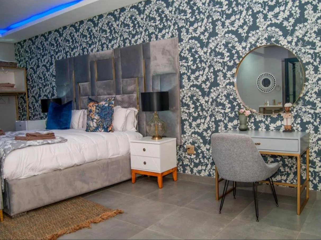 Seating area, Bed in The Lux Hotel and Resorts