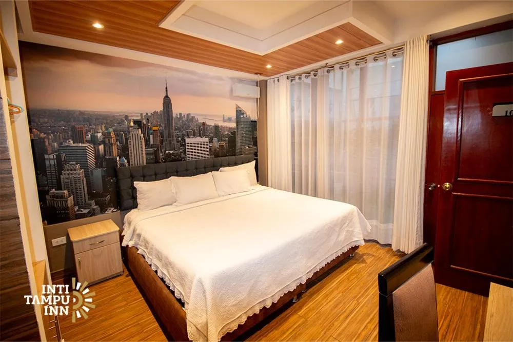 Bed in Inti Tampu Inn