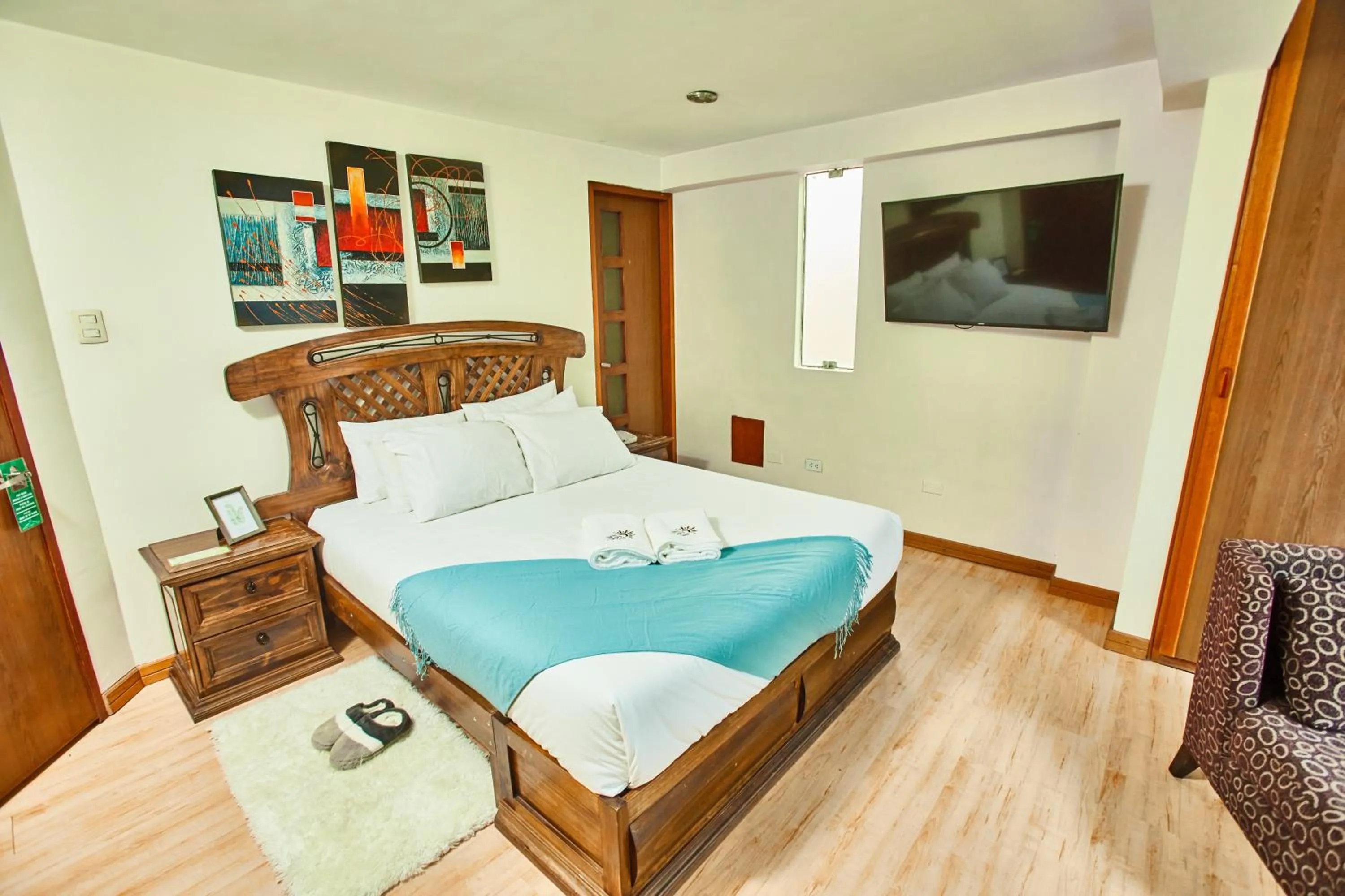 Bed in Inti Tampu Inn