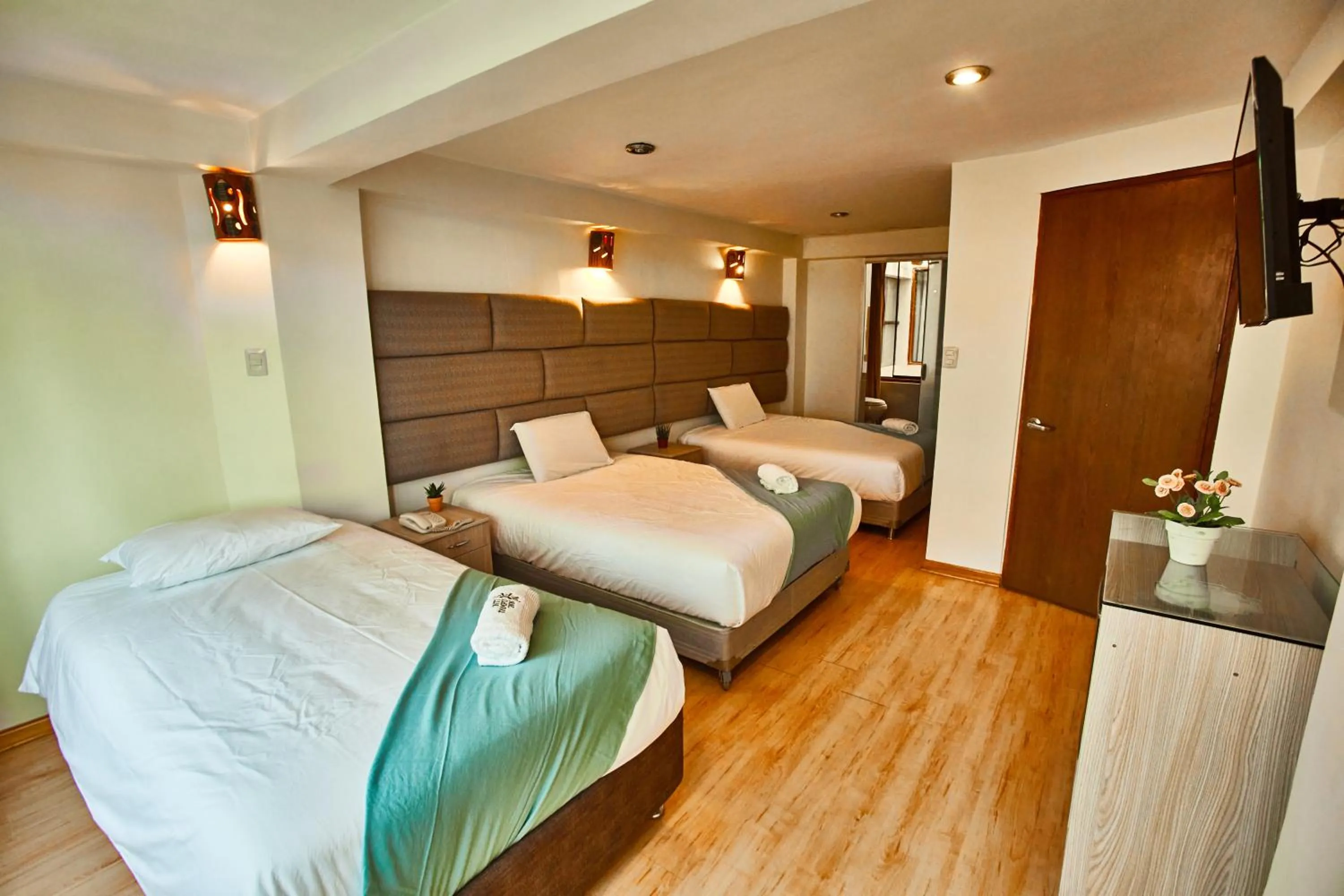 Bed in Inti Tampu Inn