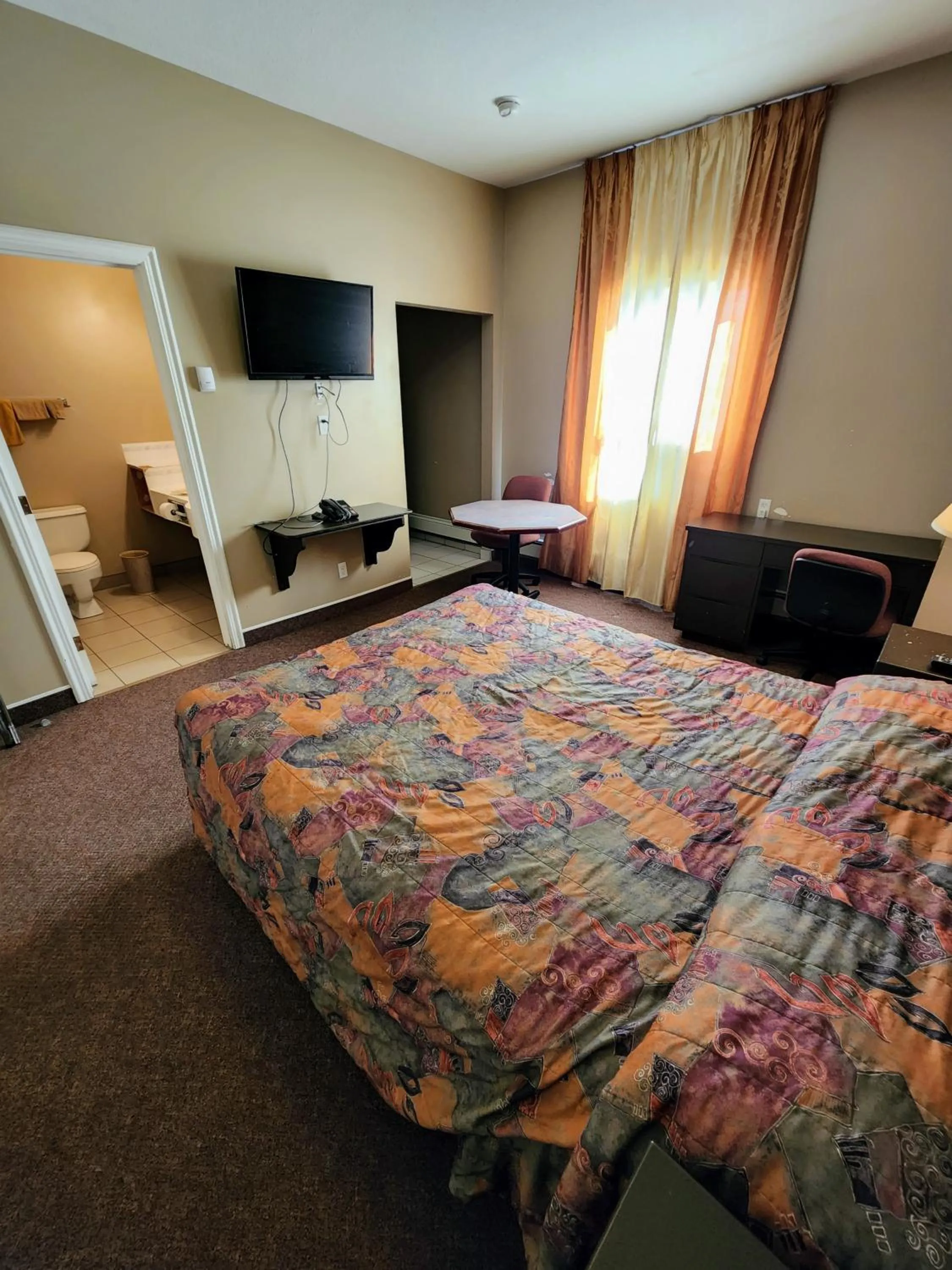 Bed in Bonnyville Hotel