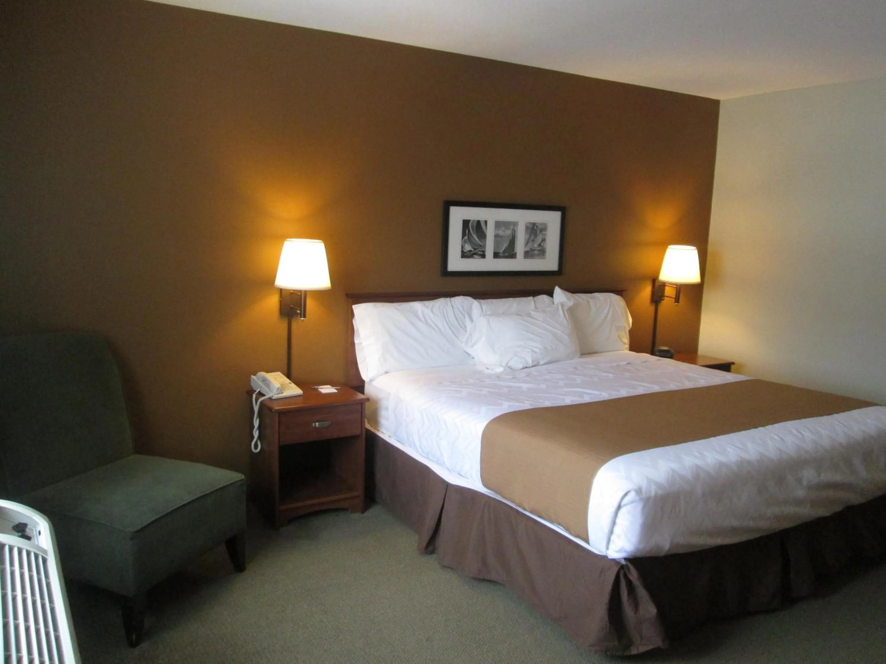 Bed in AmericInn by Wyndham Charlevoix