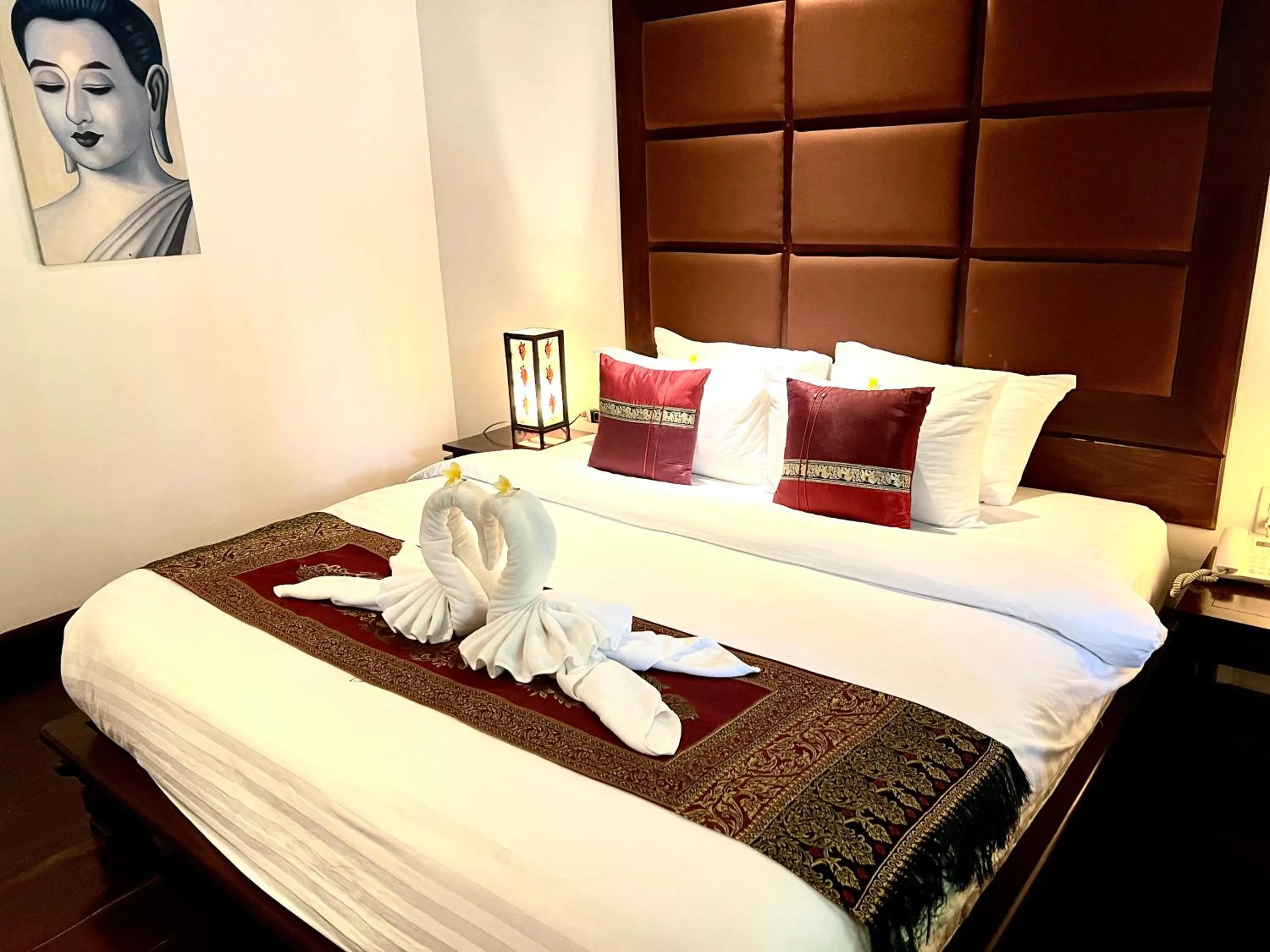 Bed in Meuangluang Hotel
