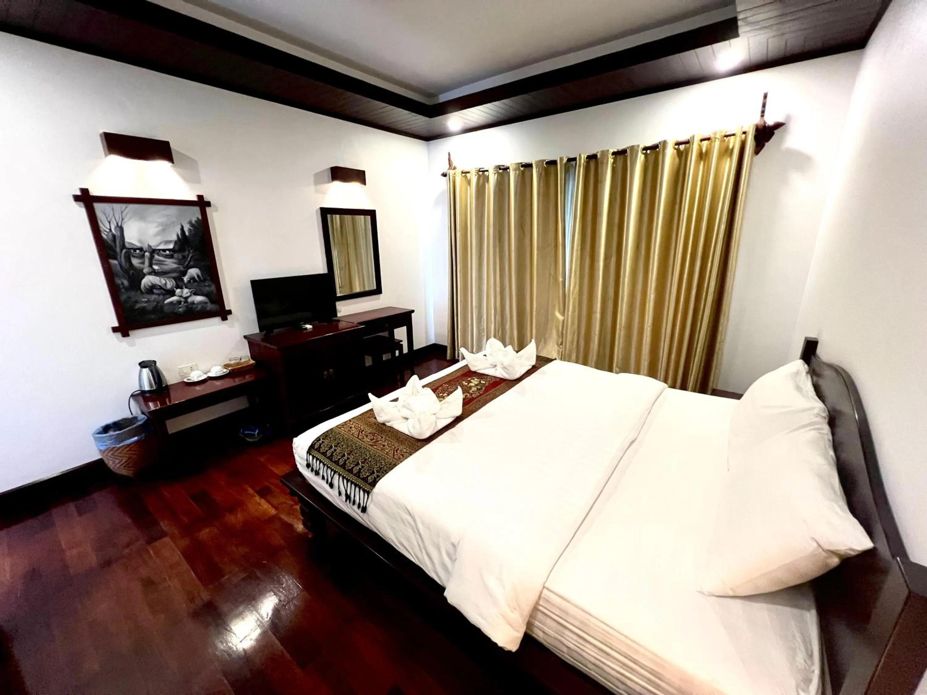 Bed in Meuangluang Hotel