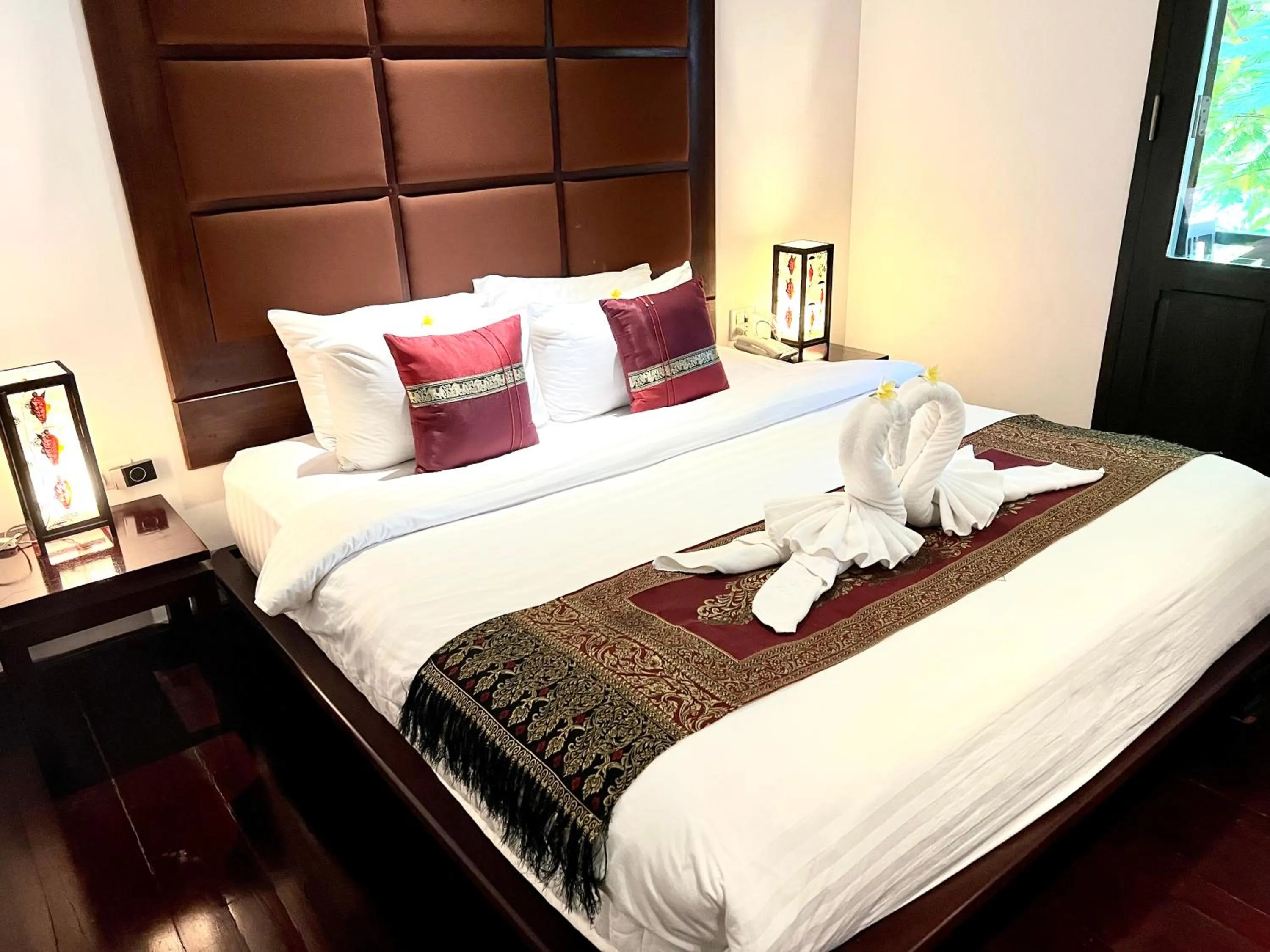 Bed in Meuangluang Hotel
