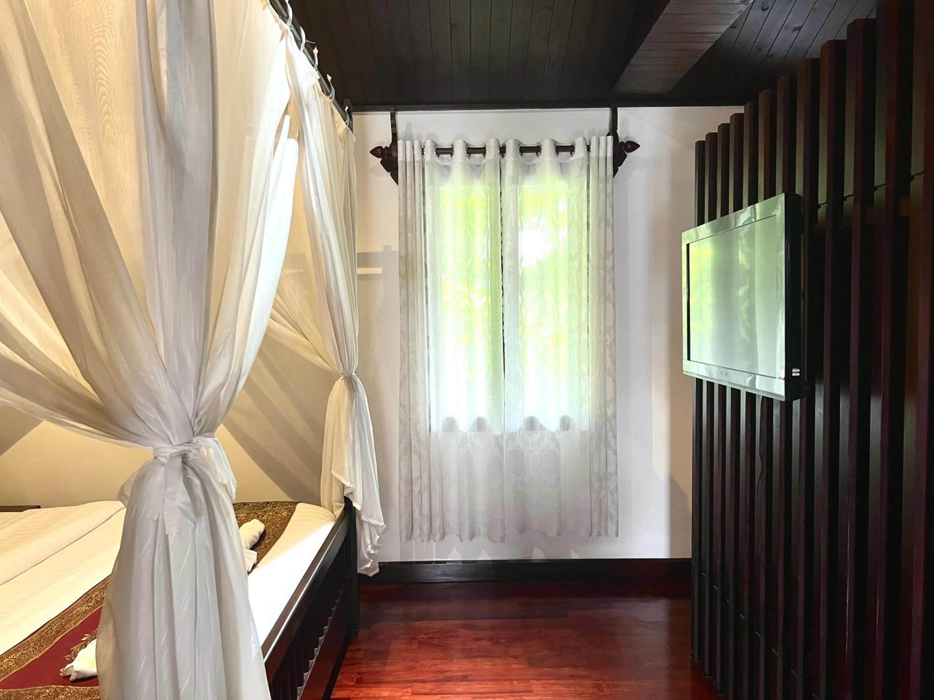 Bedroom in Meuangluang Hotel