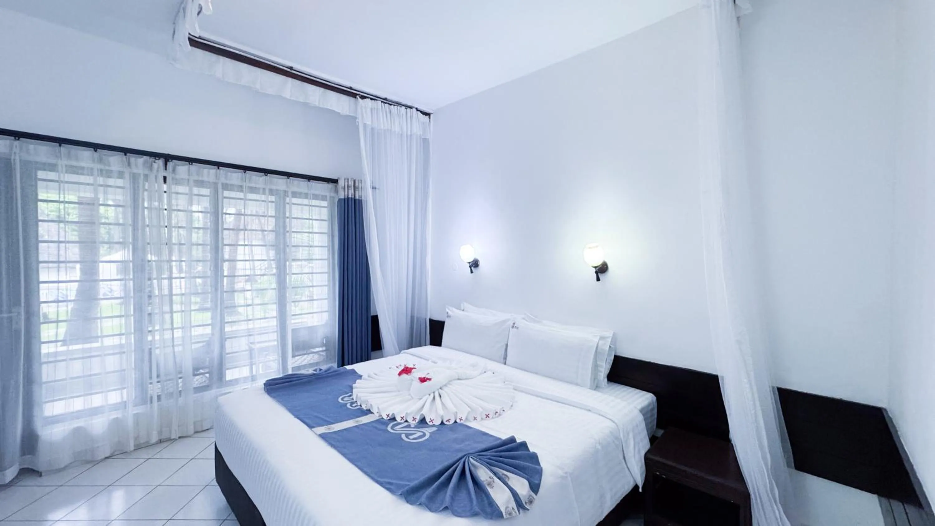 Bed in Milele Beach Hotel