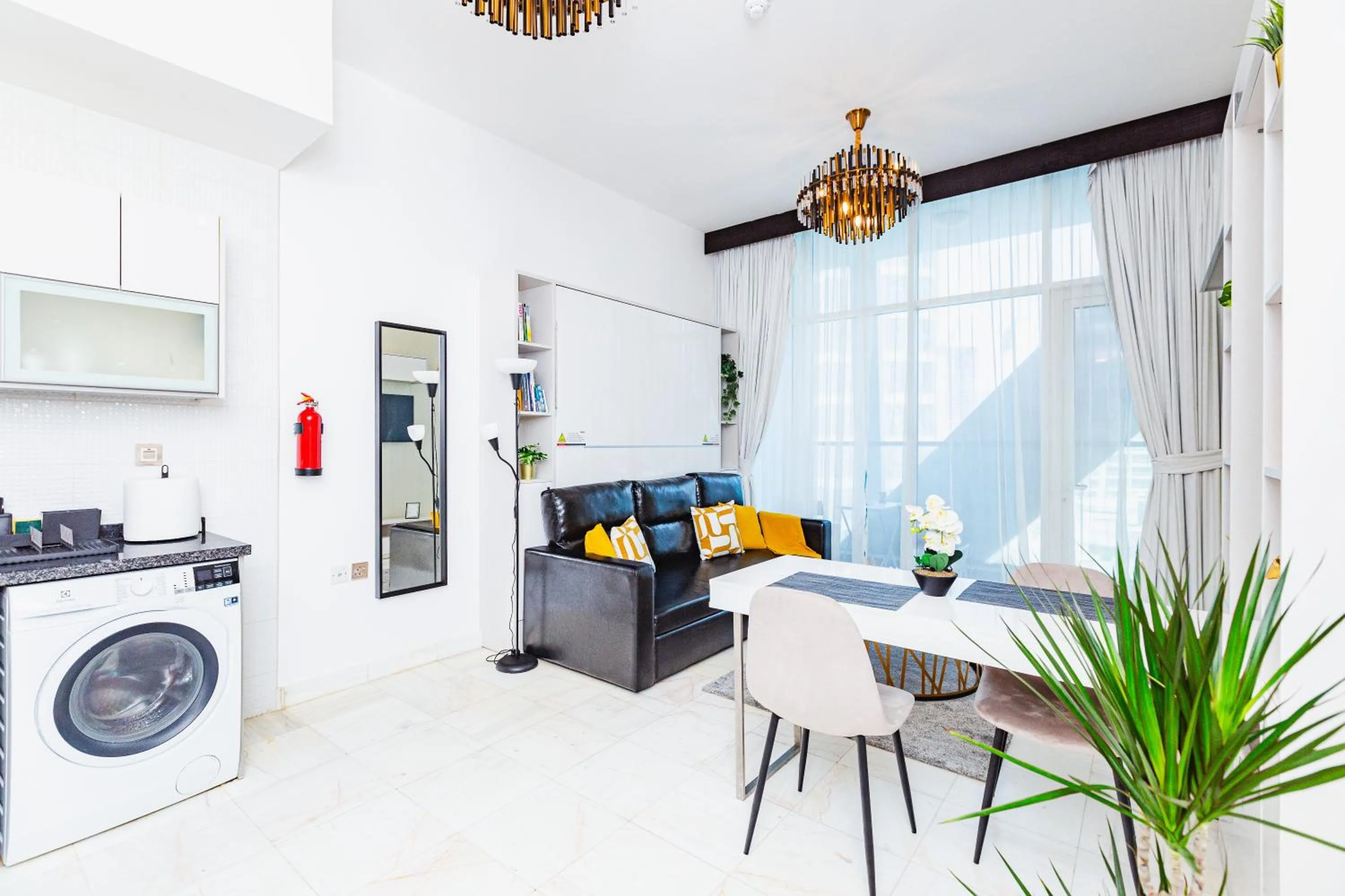 Living room in Waves Holiday Homes - Chic Studio With Balcony Overlooking City Views