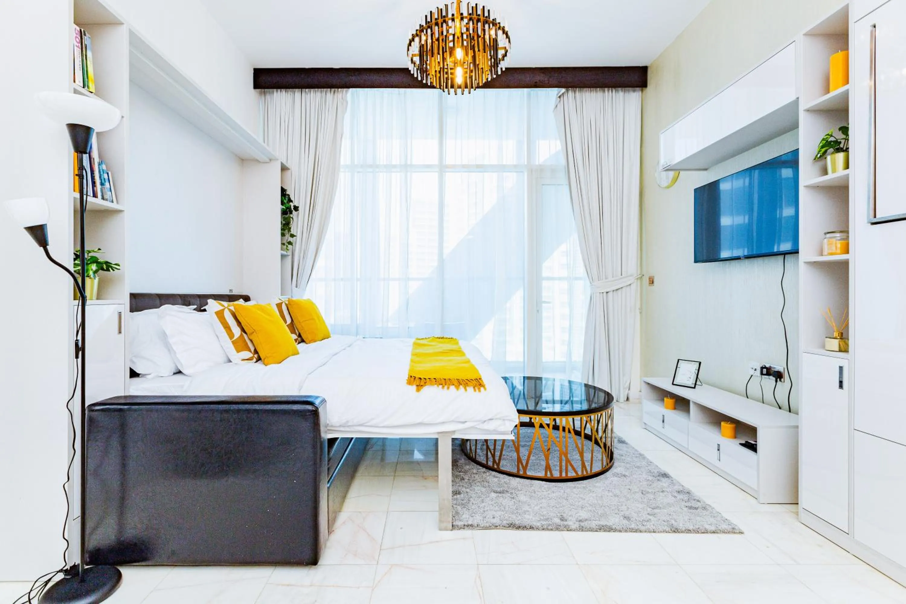 Bedroom, Bed in Waves Holiday Homes - Chic Studio With Balcony Overlooking City Views