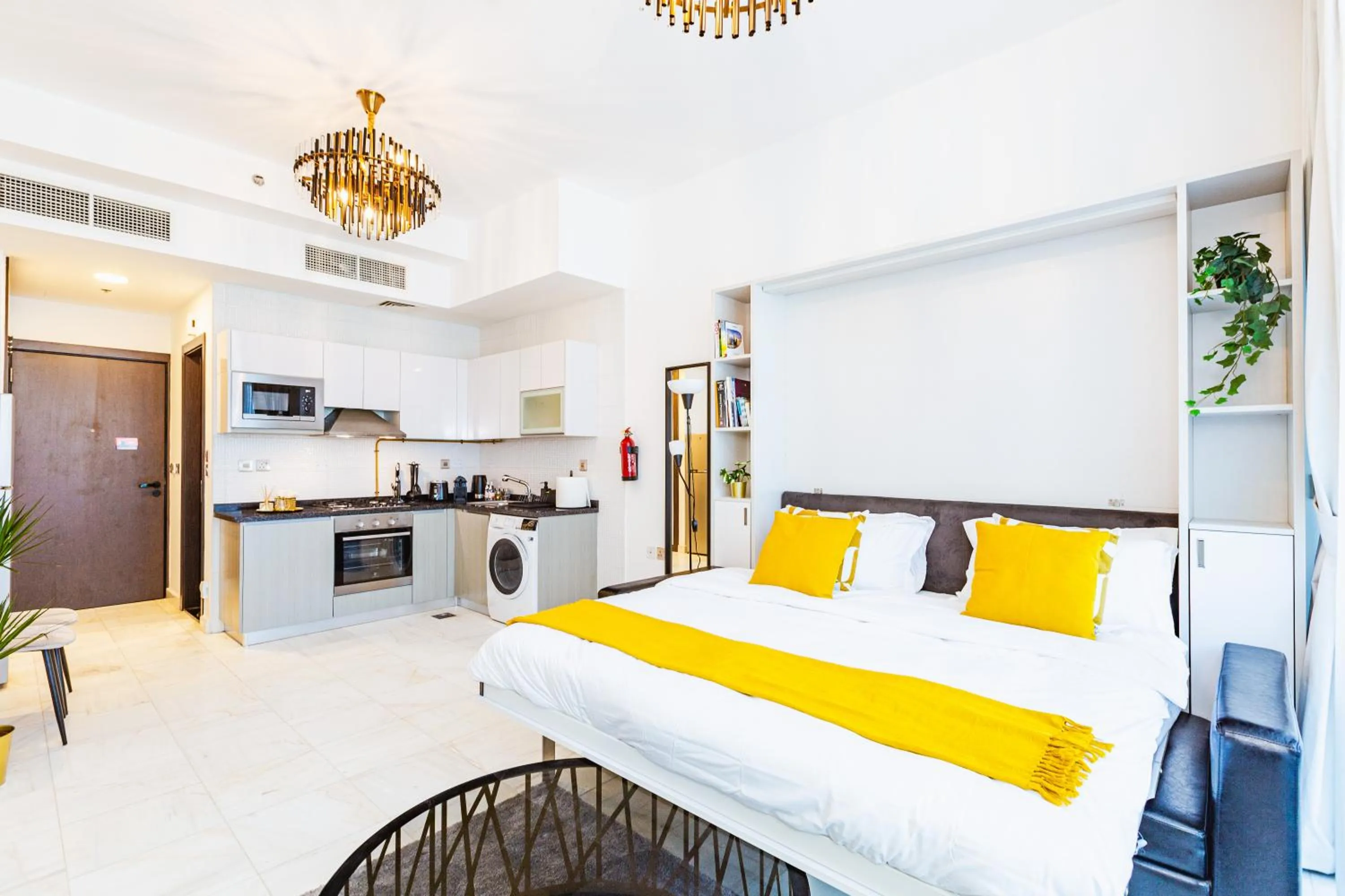 Bed in Waves Holiday Homes - Chic Studio With Balcony Overlooking City Views