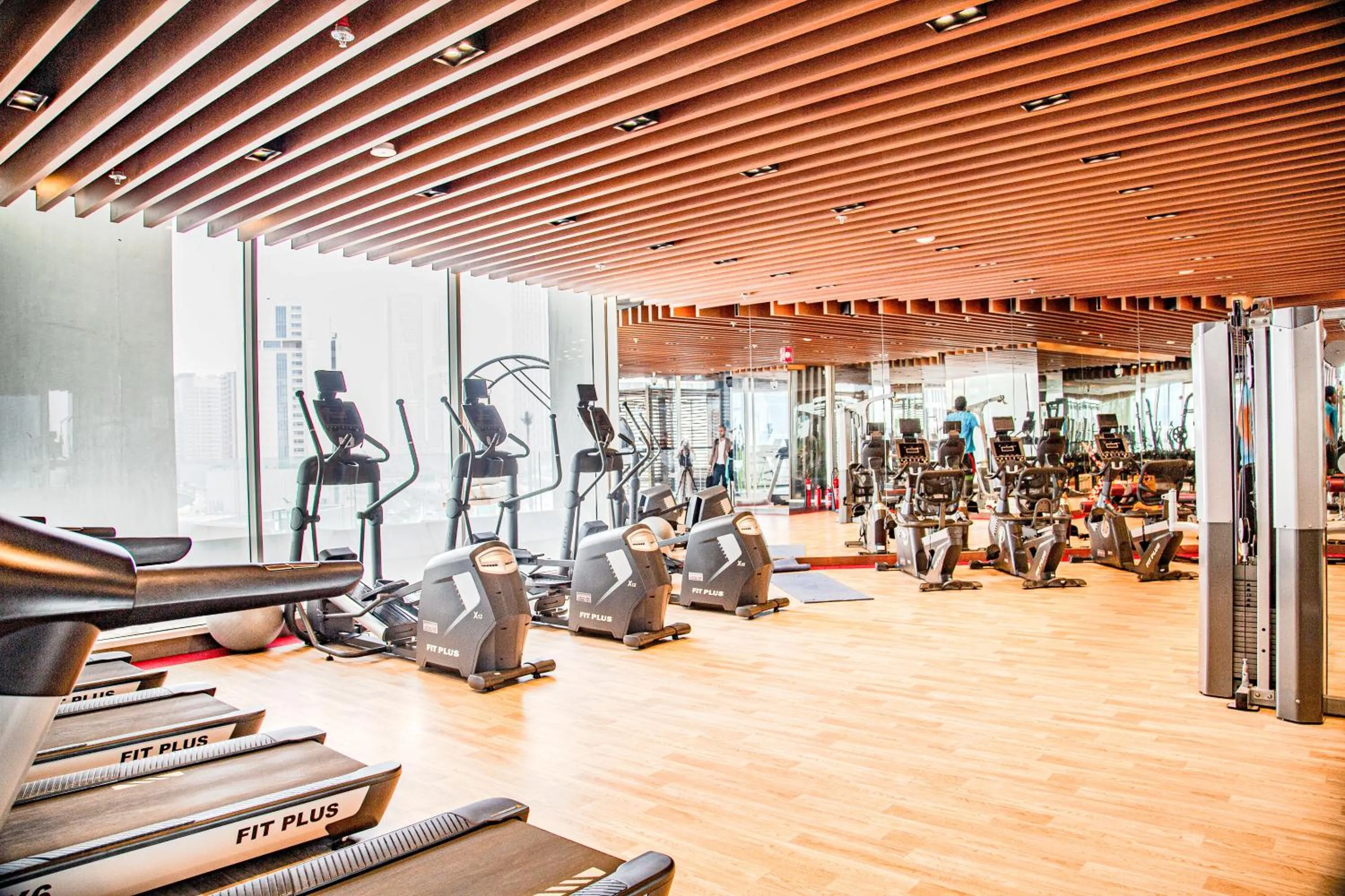 Fitness centre/facilities in Waves Holiday Homes - Chic Studio With Balcony Overlooking City Views