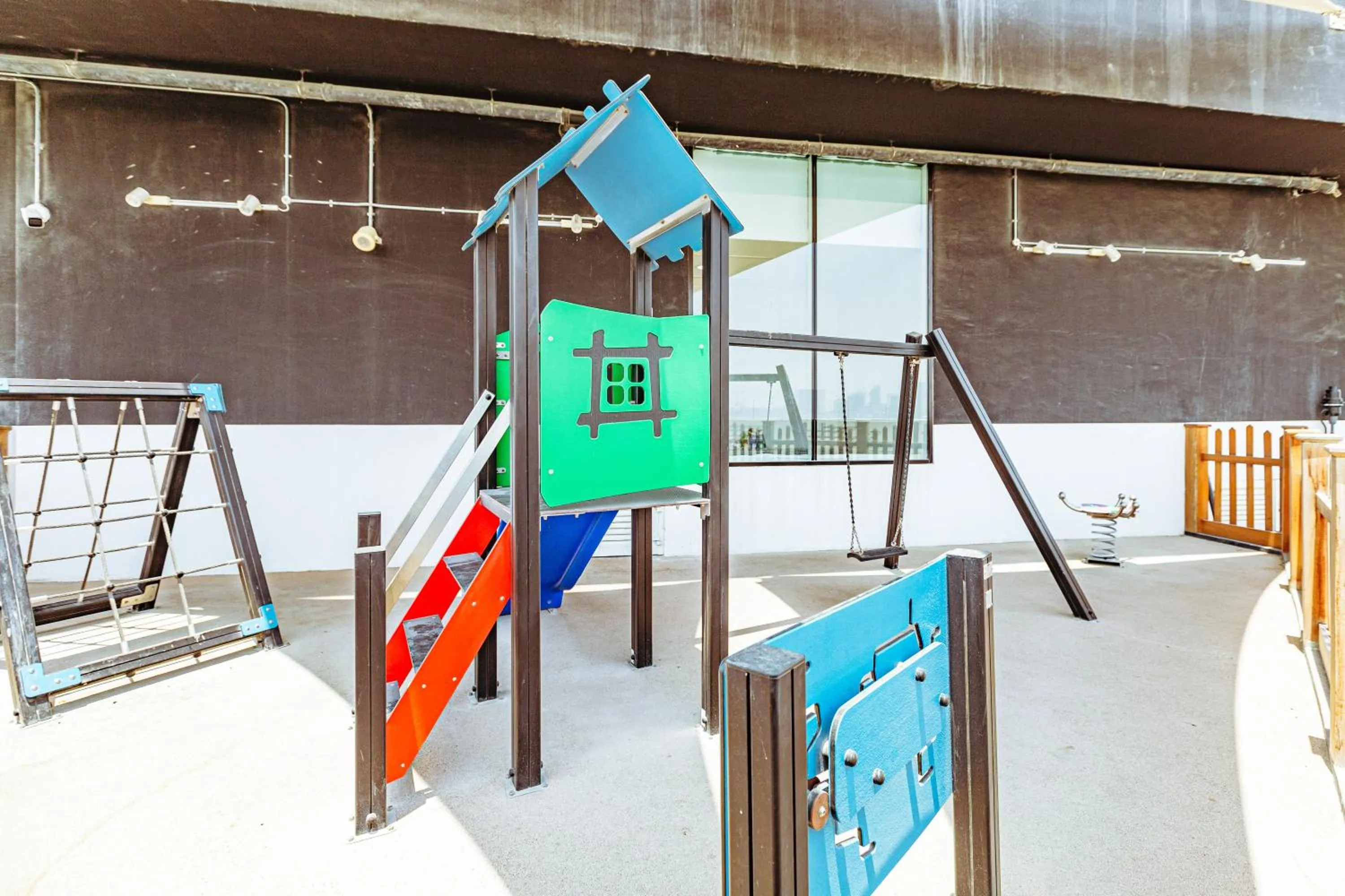 Children play ground in Waves Holiday Homes - Chic Studio With Balcony Overlooking City Views