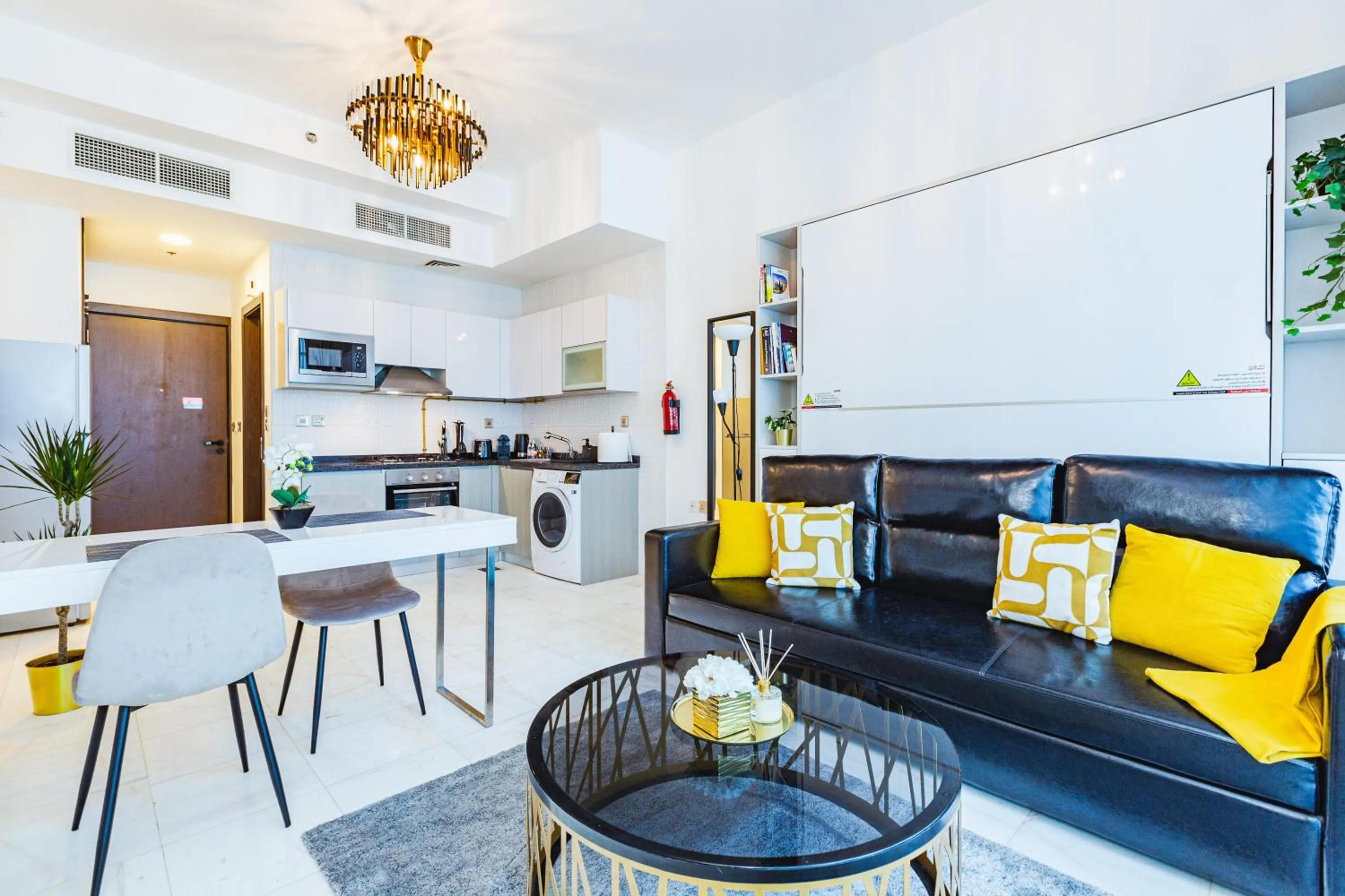 Living room in Waves Holiday Homes - Chic Studio With Balcony Overlooking City Views