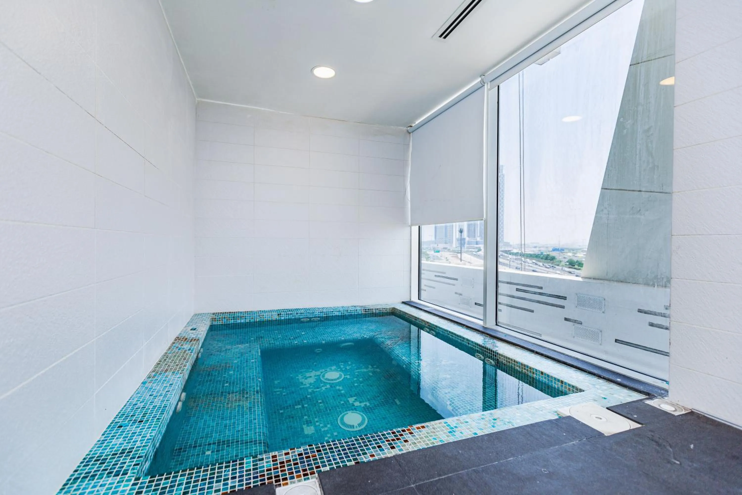 Swimming pool in Waves Holiday Homes - Chic Studio With Balcony Overlooking City Views