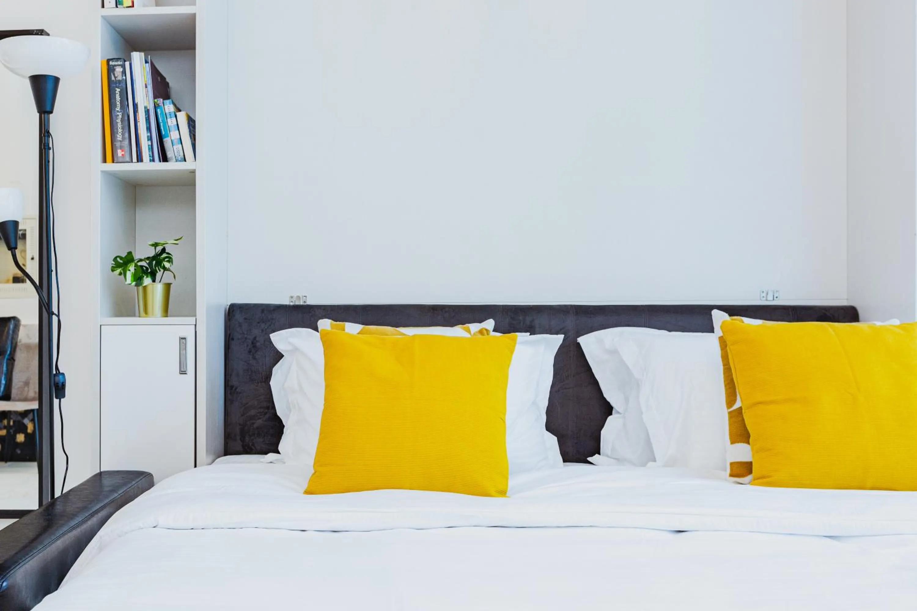 Bed in Waves Holiday Homes - Chic Studio With Balcony Overlooking City Views
