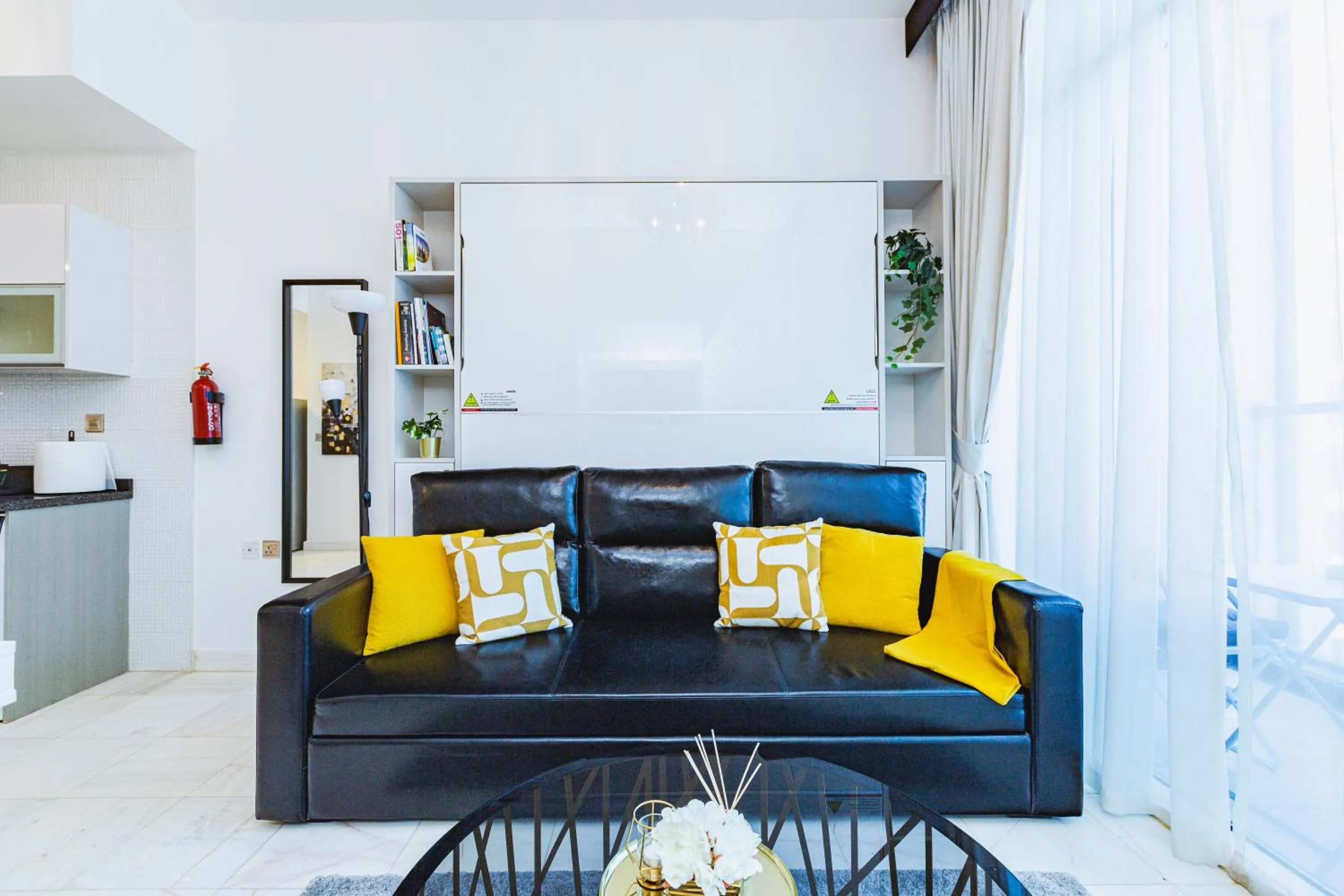Living room in Waves Holiday Homes - Chic Studio With Balcony Overlooking City Views