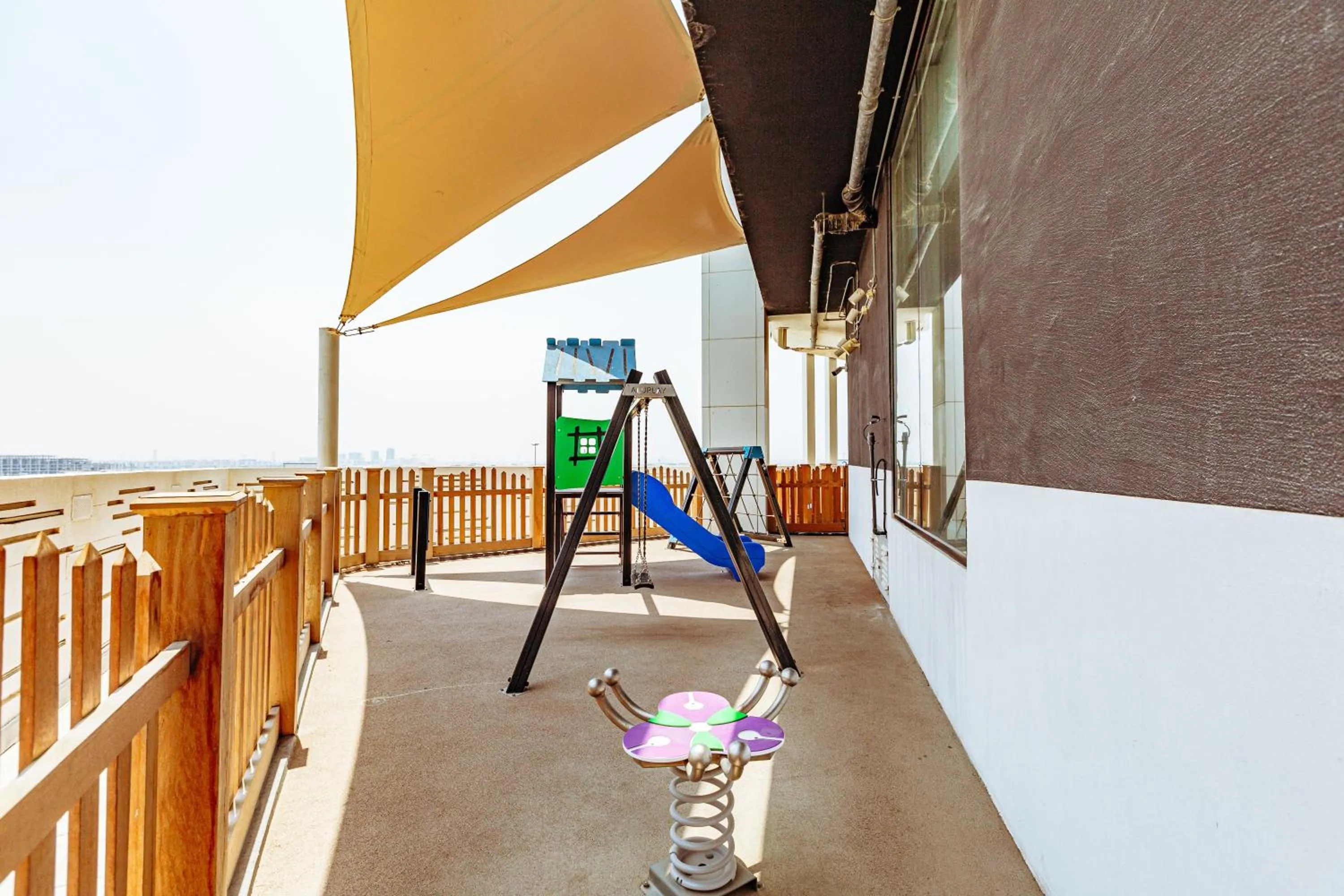 Children play ground in Waves Holiday Homes - Chic Studio With Balcony Overlooking City Views
