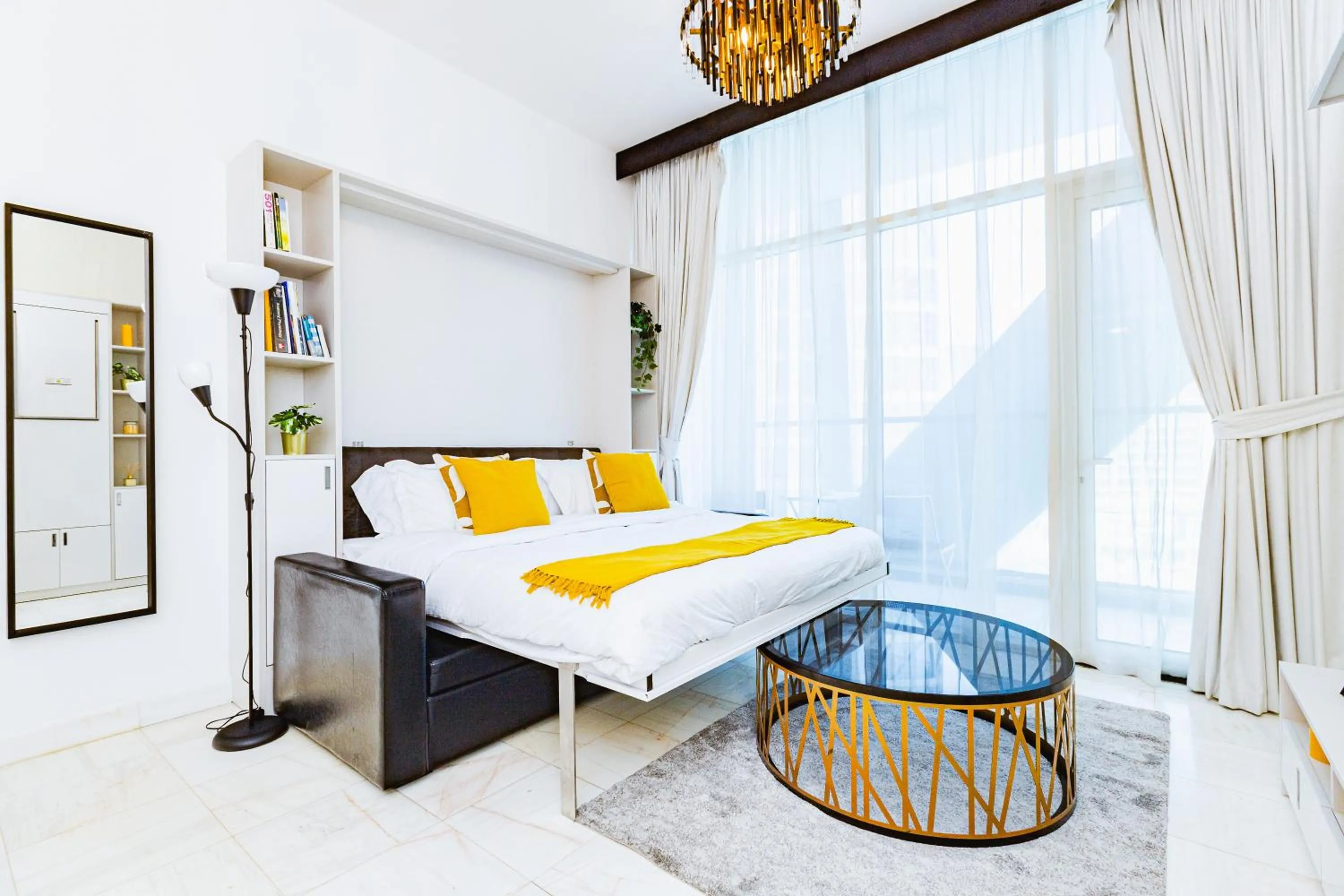 Bedroom, Bed in Waves Holiday Homes - Chic Studio With Balcony Overlooking City Views