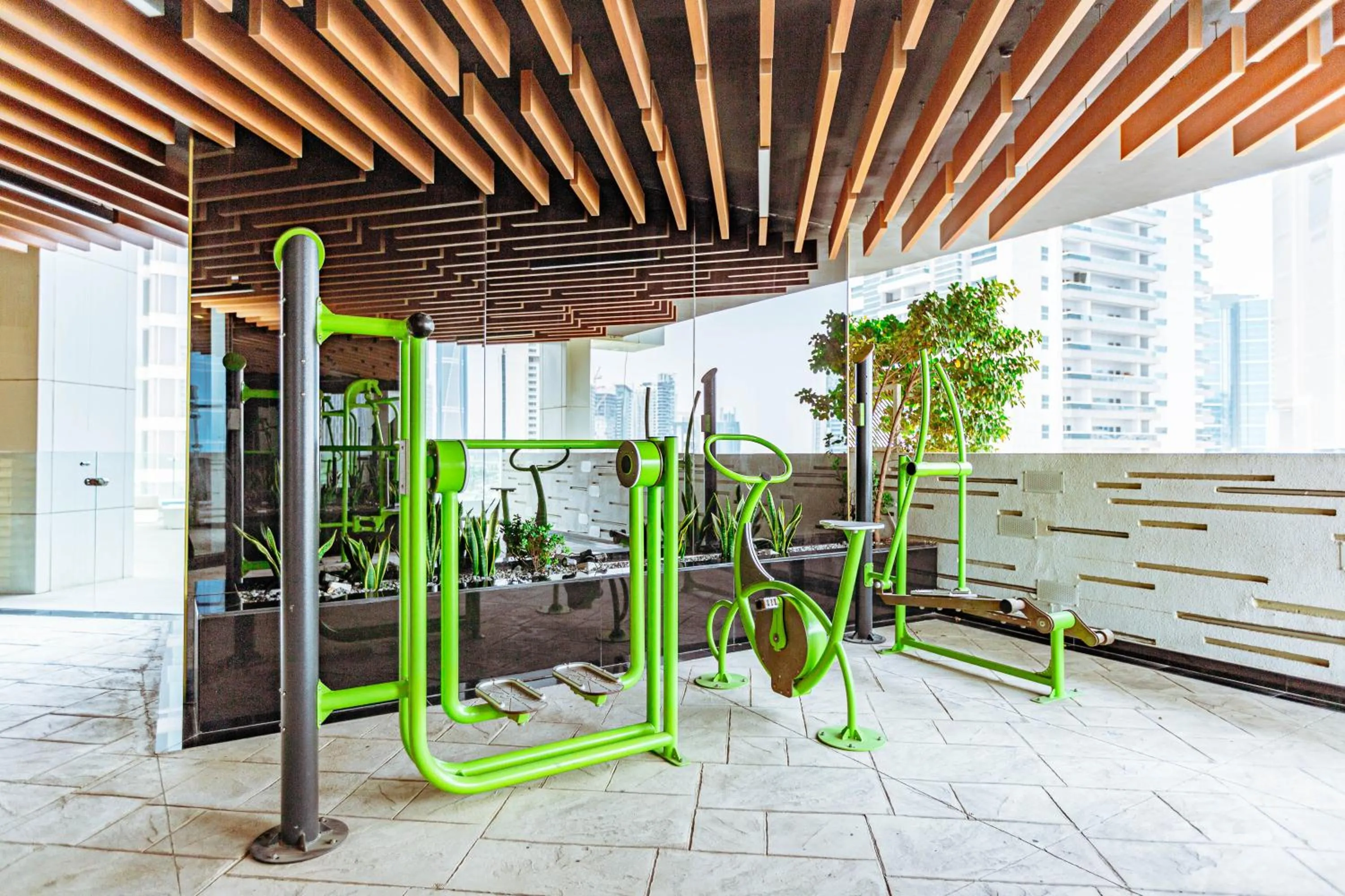 Fitness centre/facilities in Waves Holiday Homes - Chic Studio With Balcony Overlooking City Views