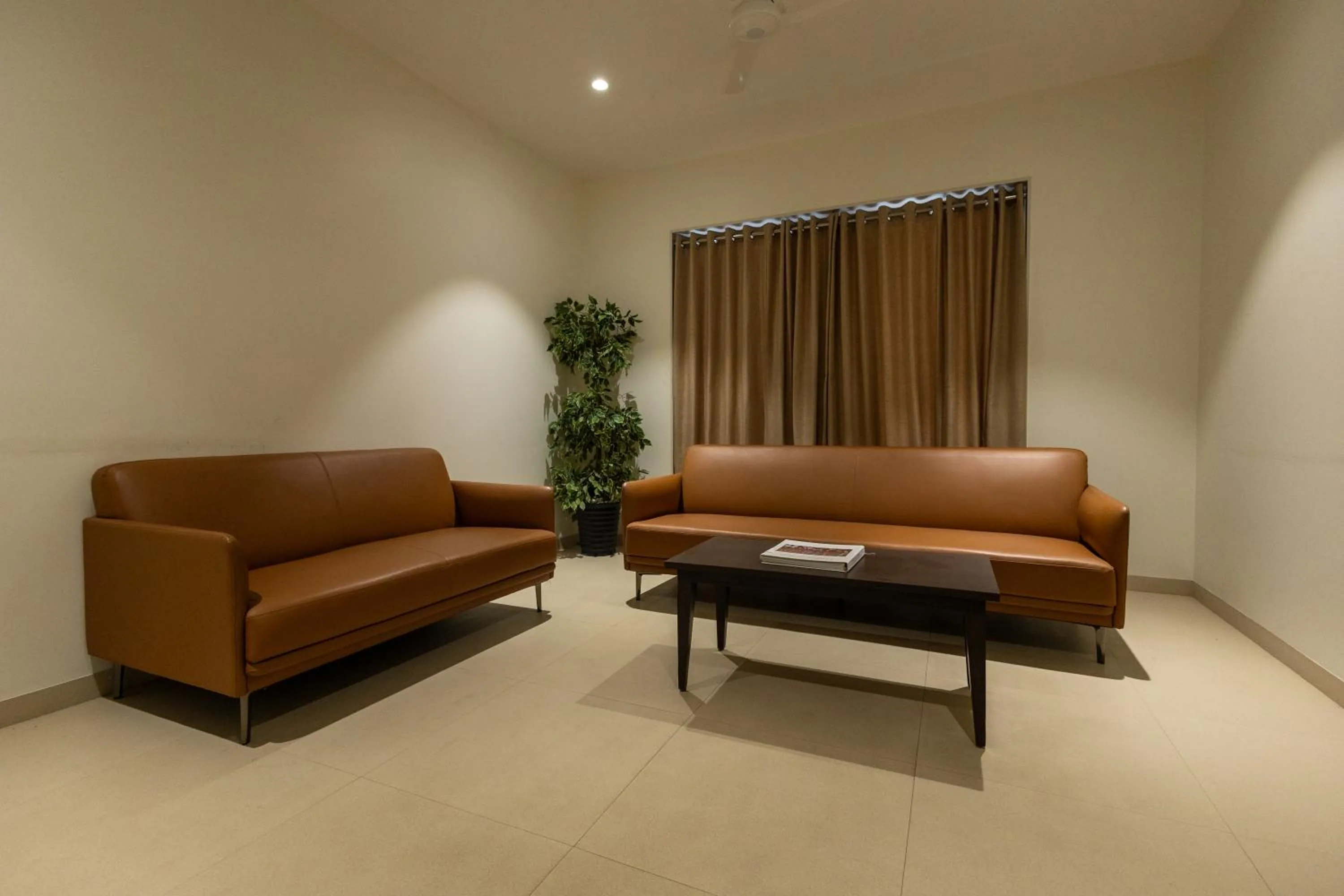 Living room in Freesia Residency by Express Inn