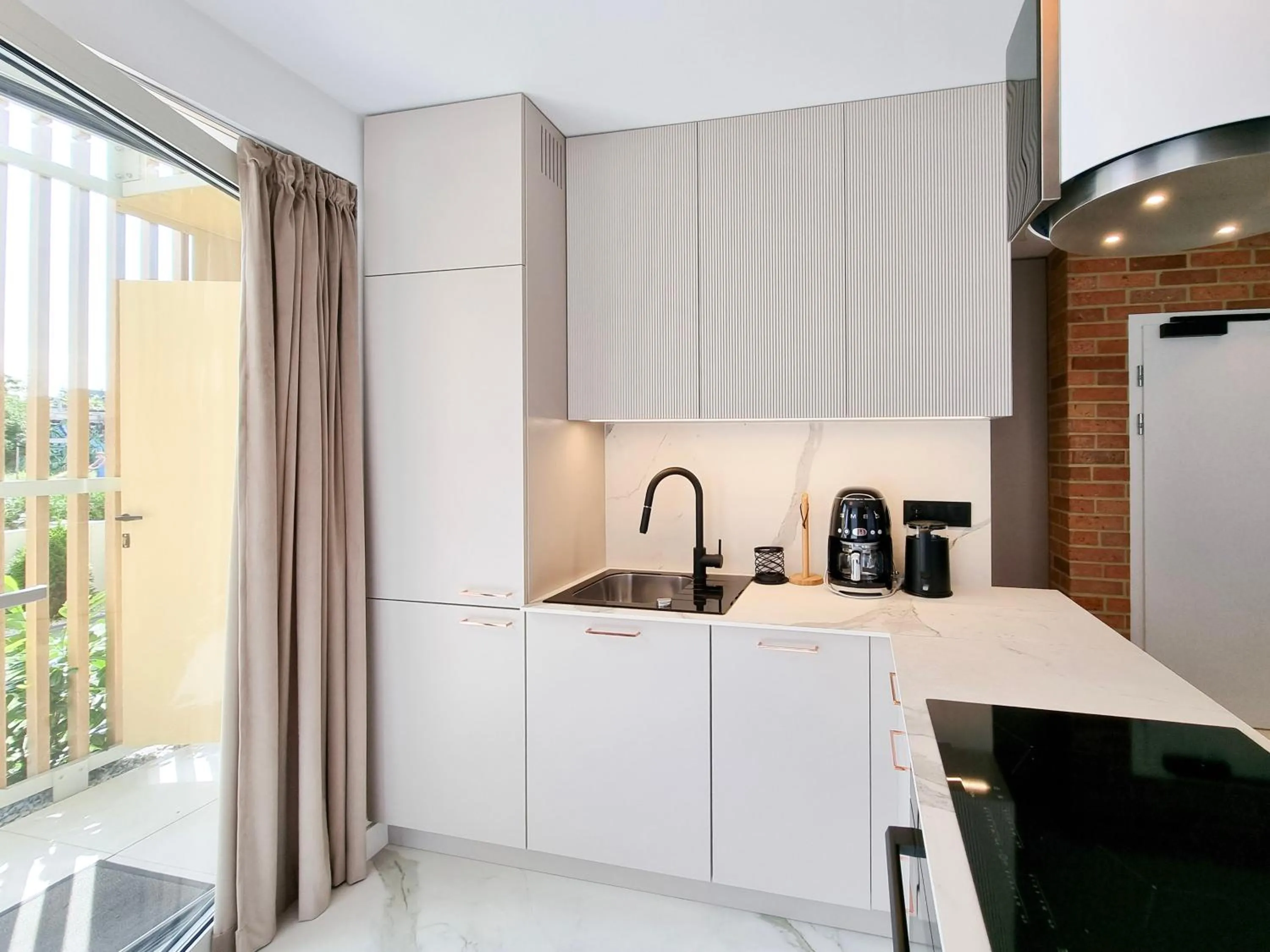Kitchen or kitchenette in visit baltic - Apartament Plażowy Casa