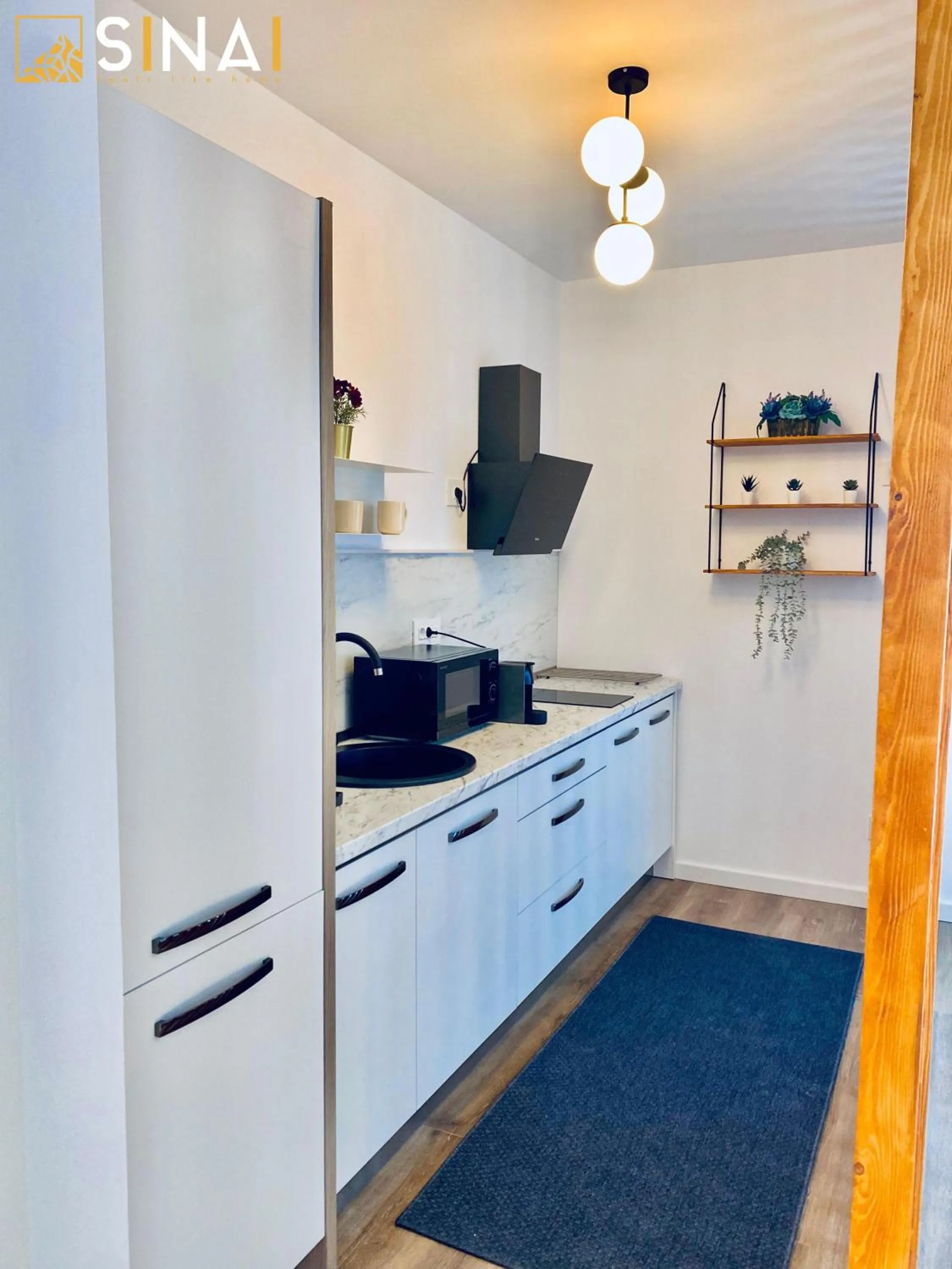Kitchen or kitchenette in SINAI APH Apartments