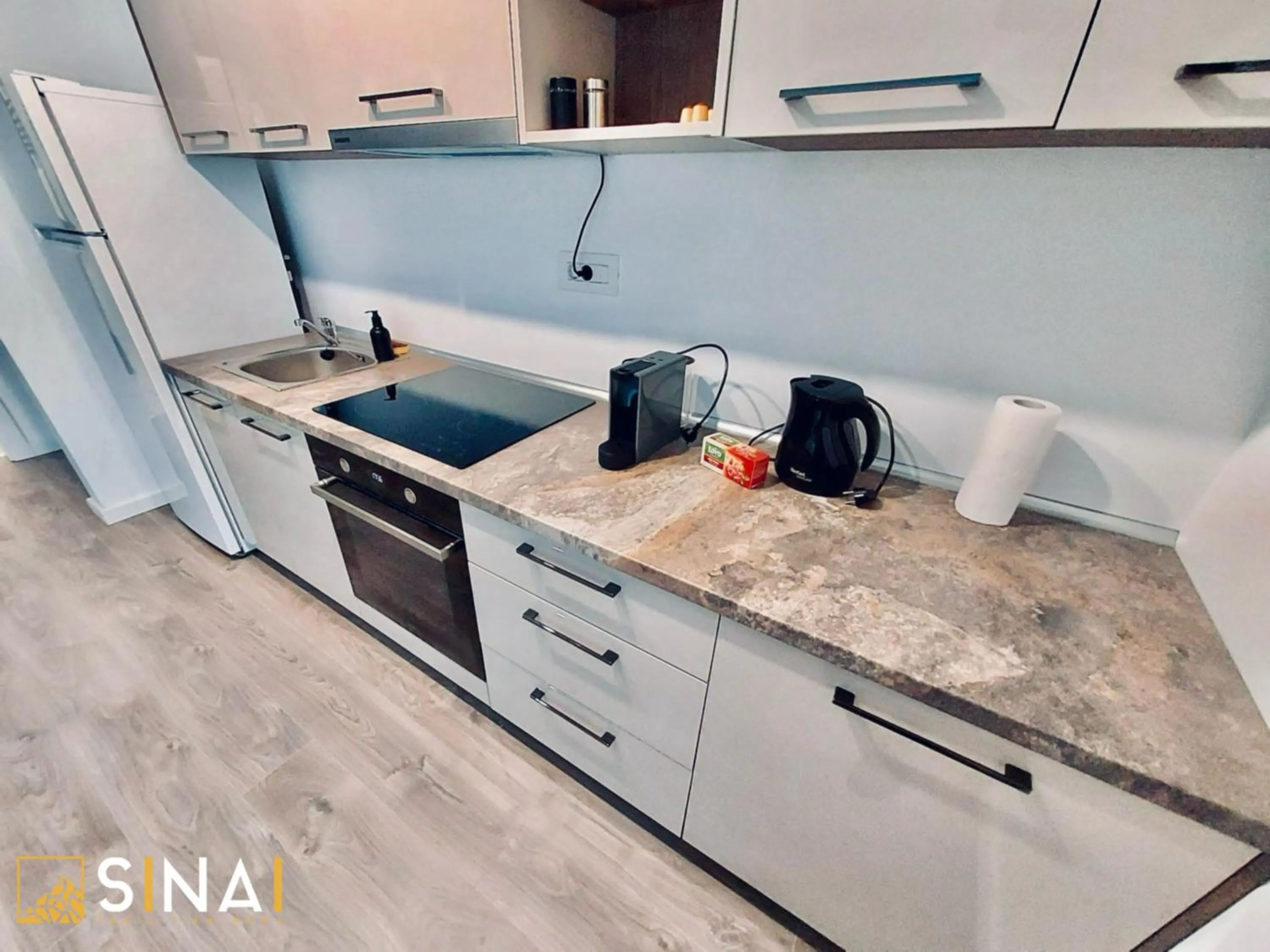 Kitchen or kitchenette in SINAI APH Apartments