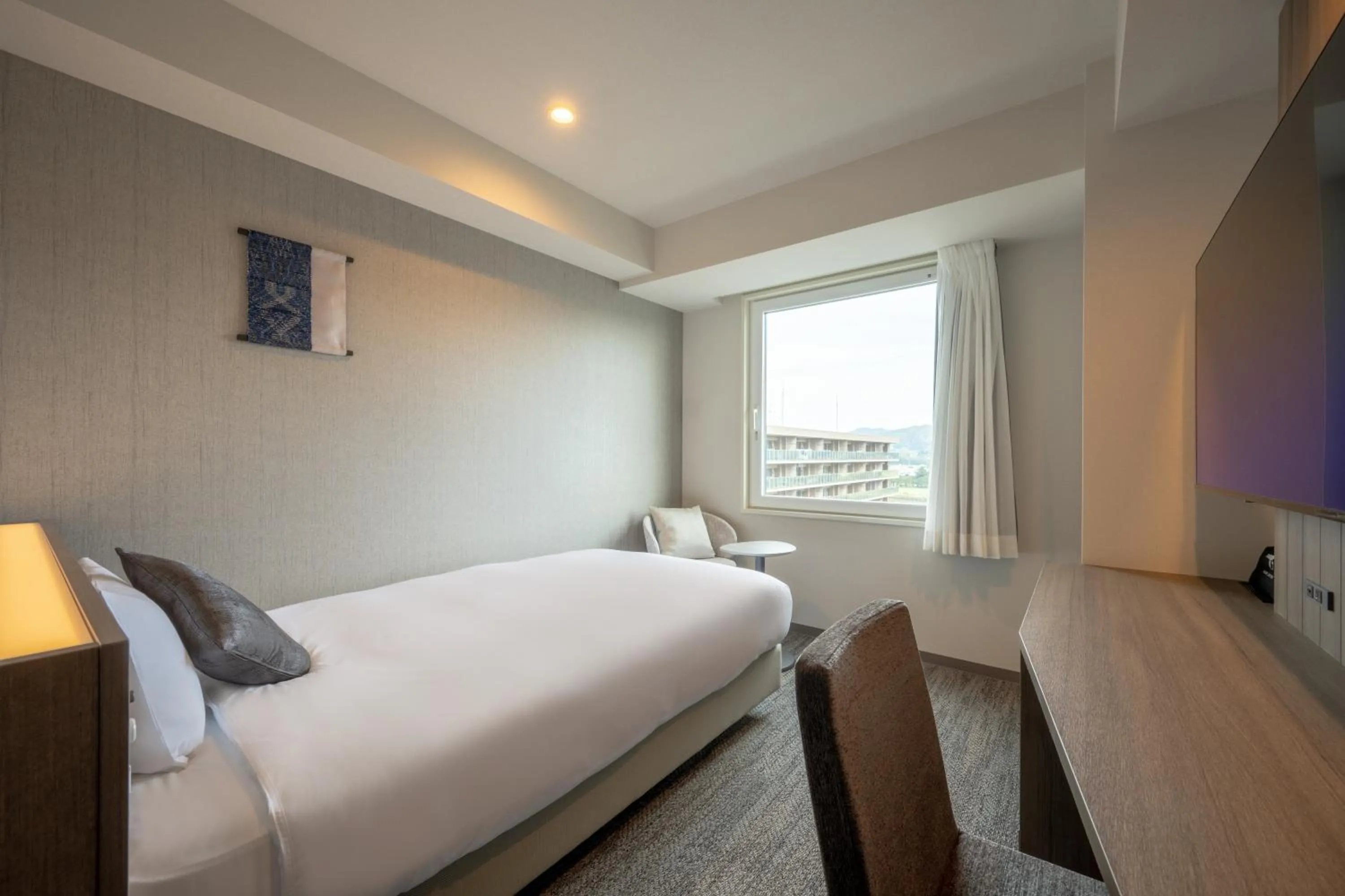 Bed in SAKURA PORT HOTEL