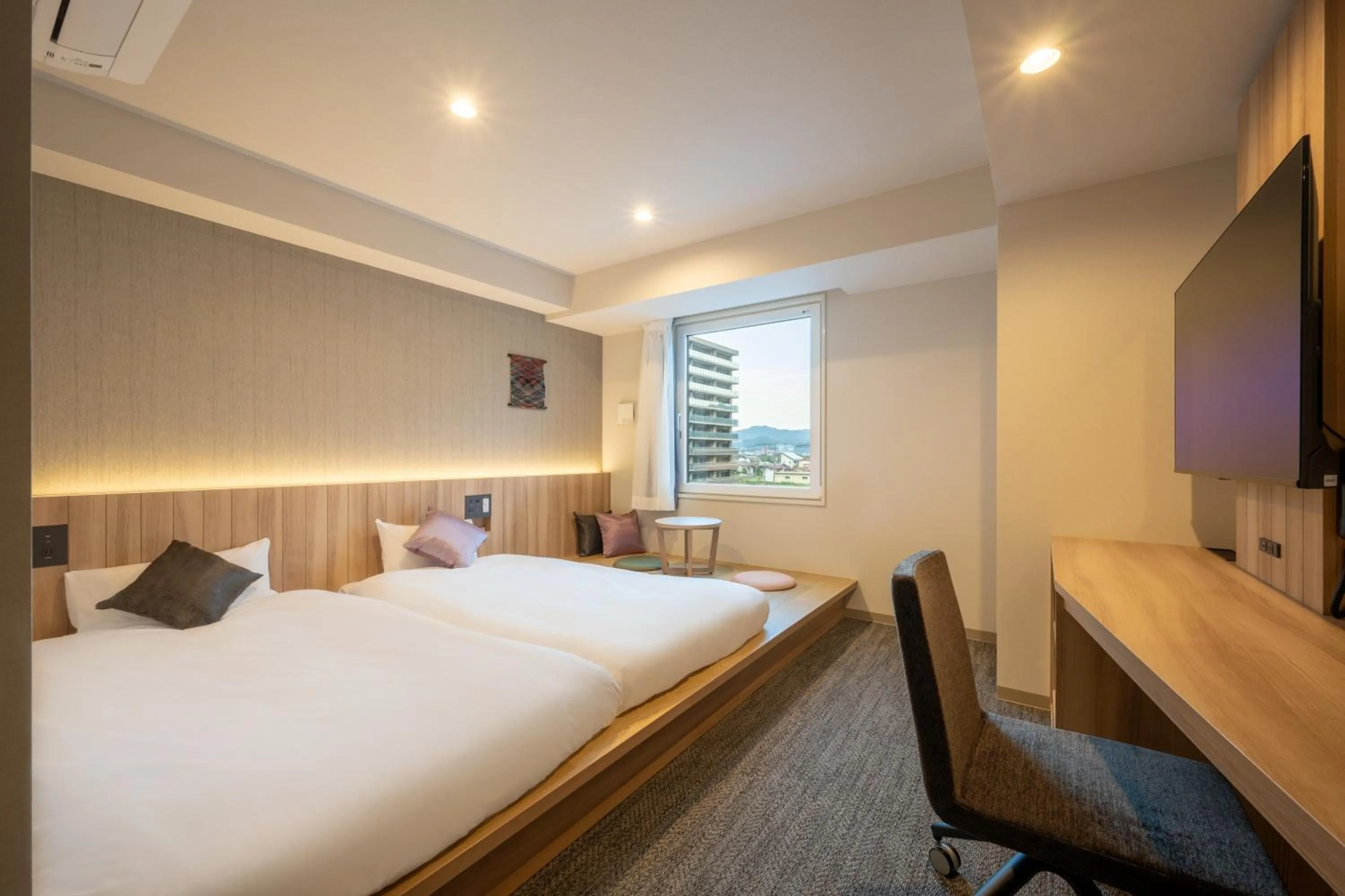 Bed in SAKURA PORT HOTEL