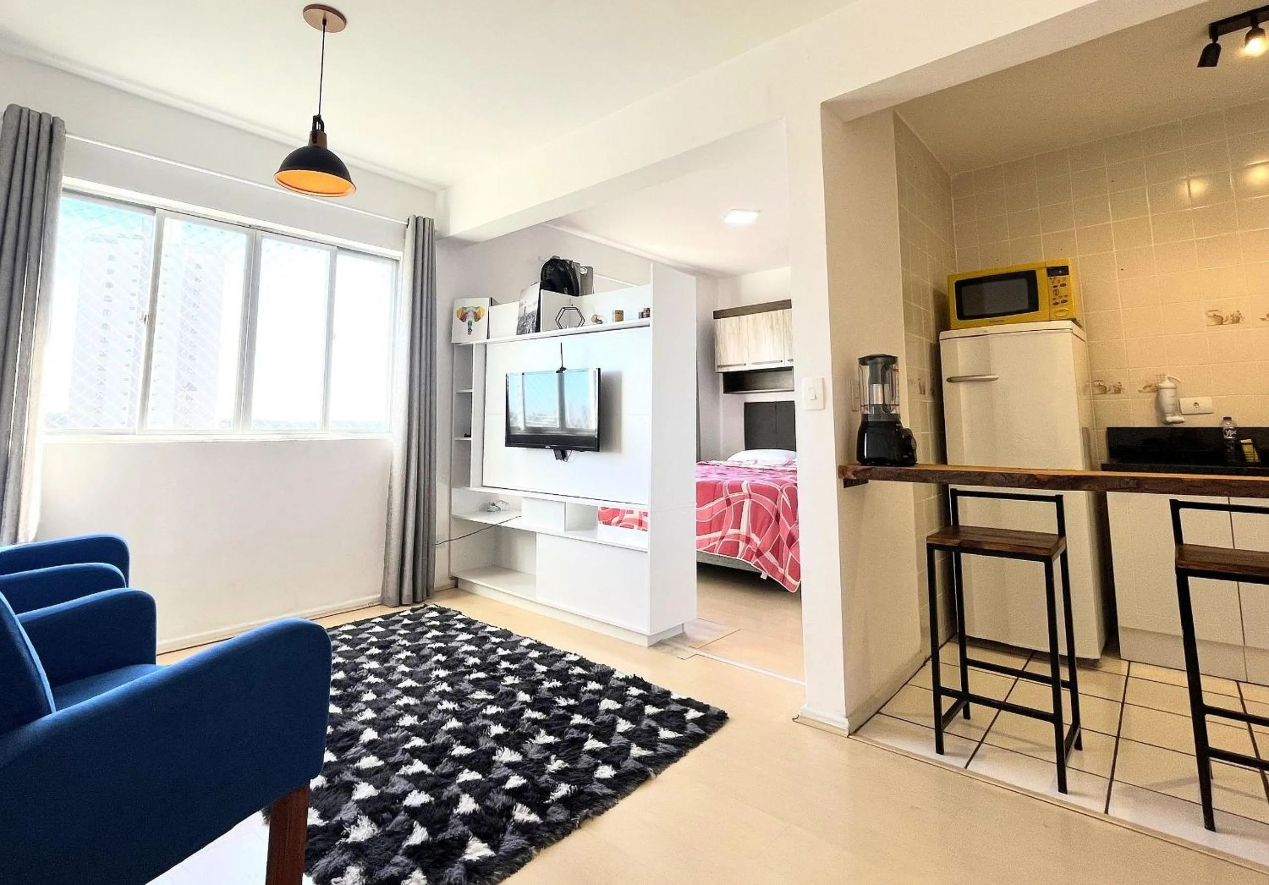 Living room in Ed. Vitoria | Bairro mais requisitado de Curitiba | Gonzaga Stays