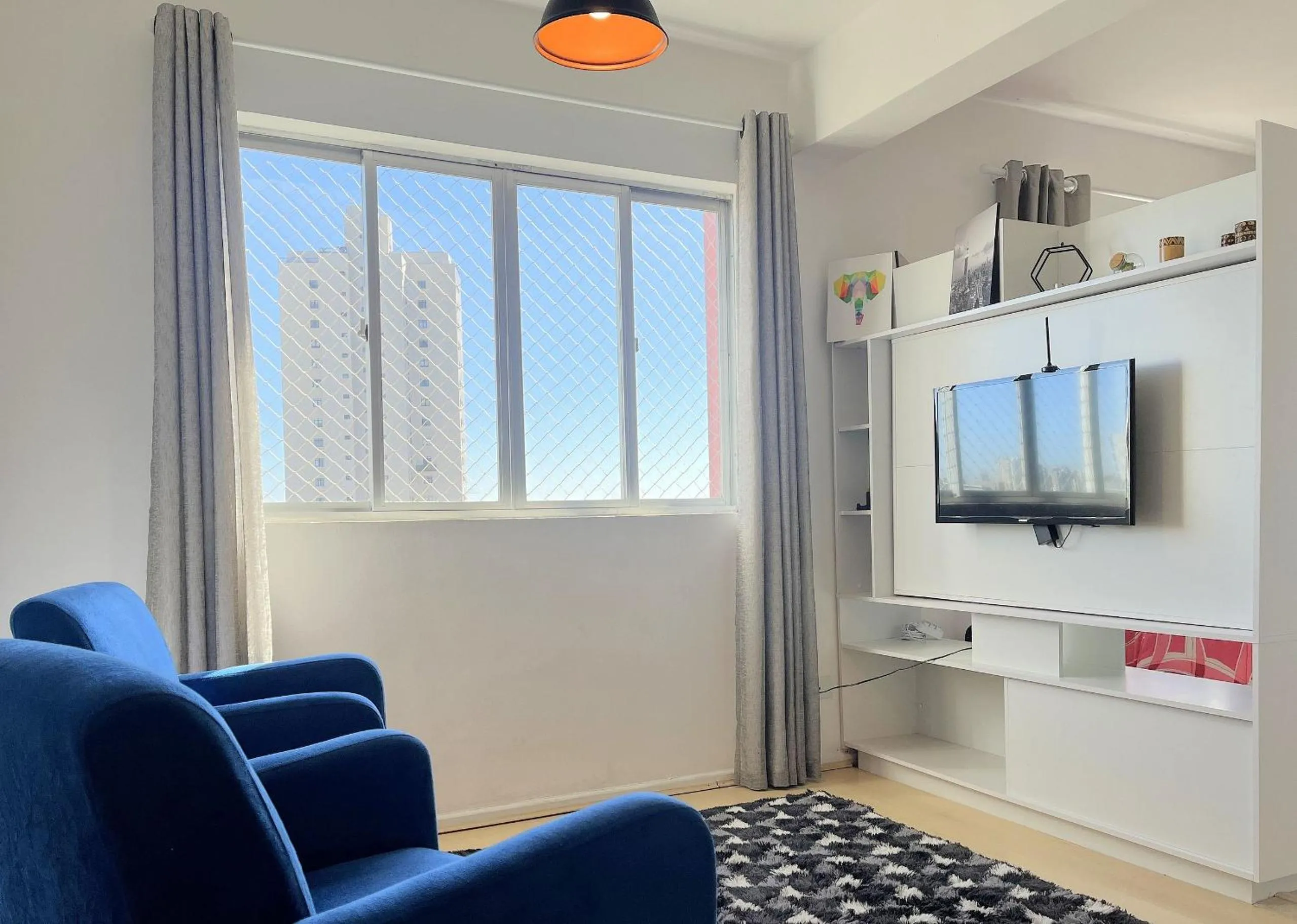 Living room in Ed. Vitoria | Bairro mais requisitado de Curitiba | Gonzaga Stays